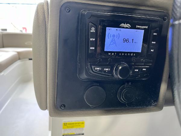 2023 Crownline Eclipse E235 XS boat stereo system displaying FM radio station 96.1.