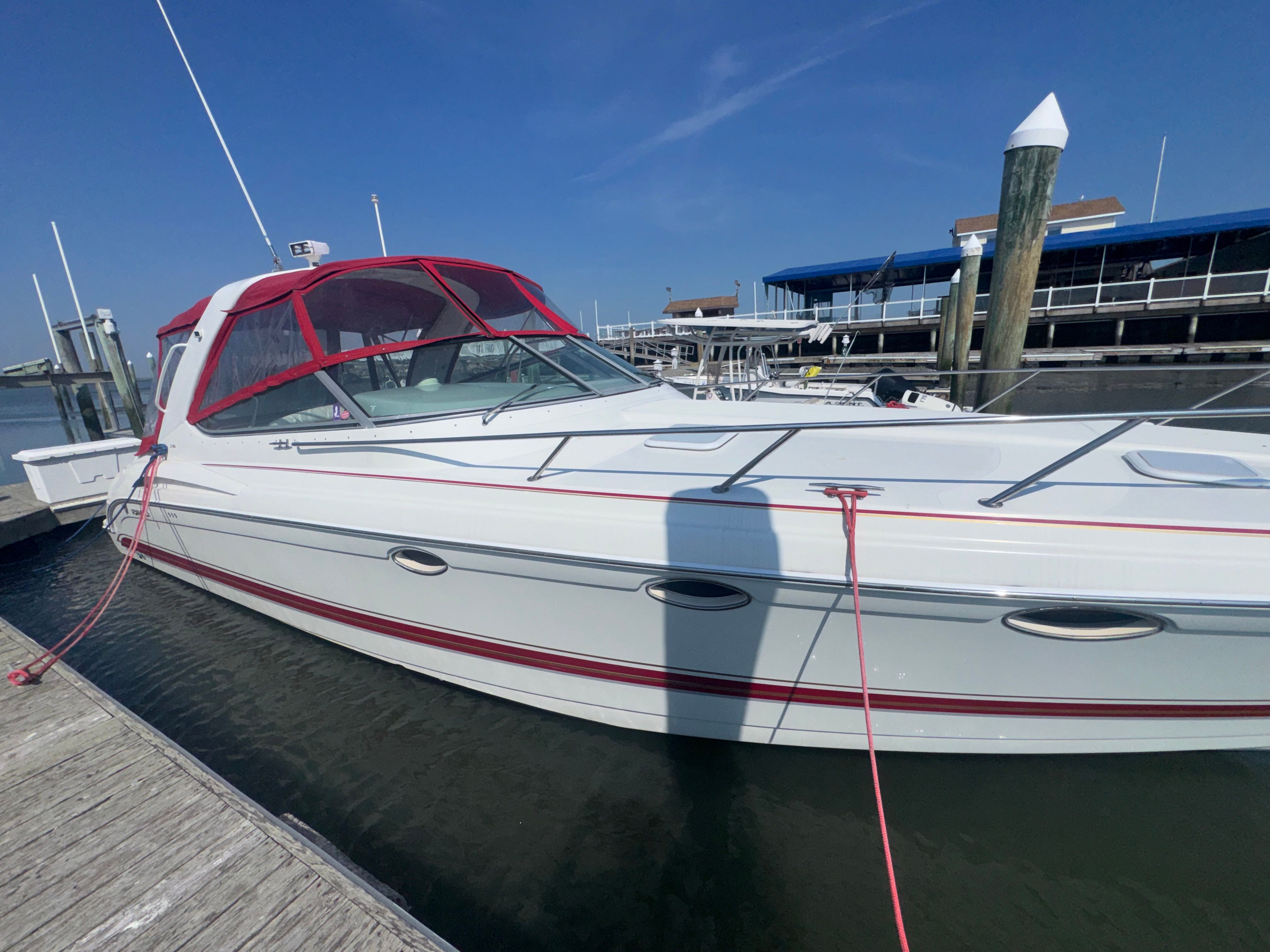2001 Formula 37 Super Sport boat docked at marina.
