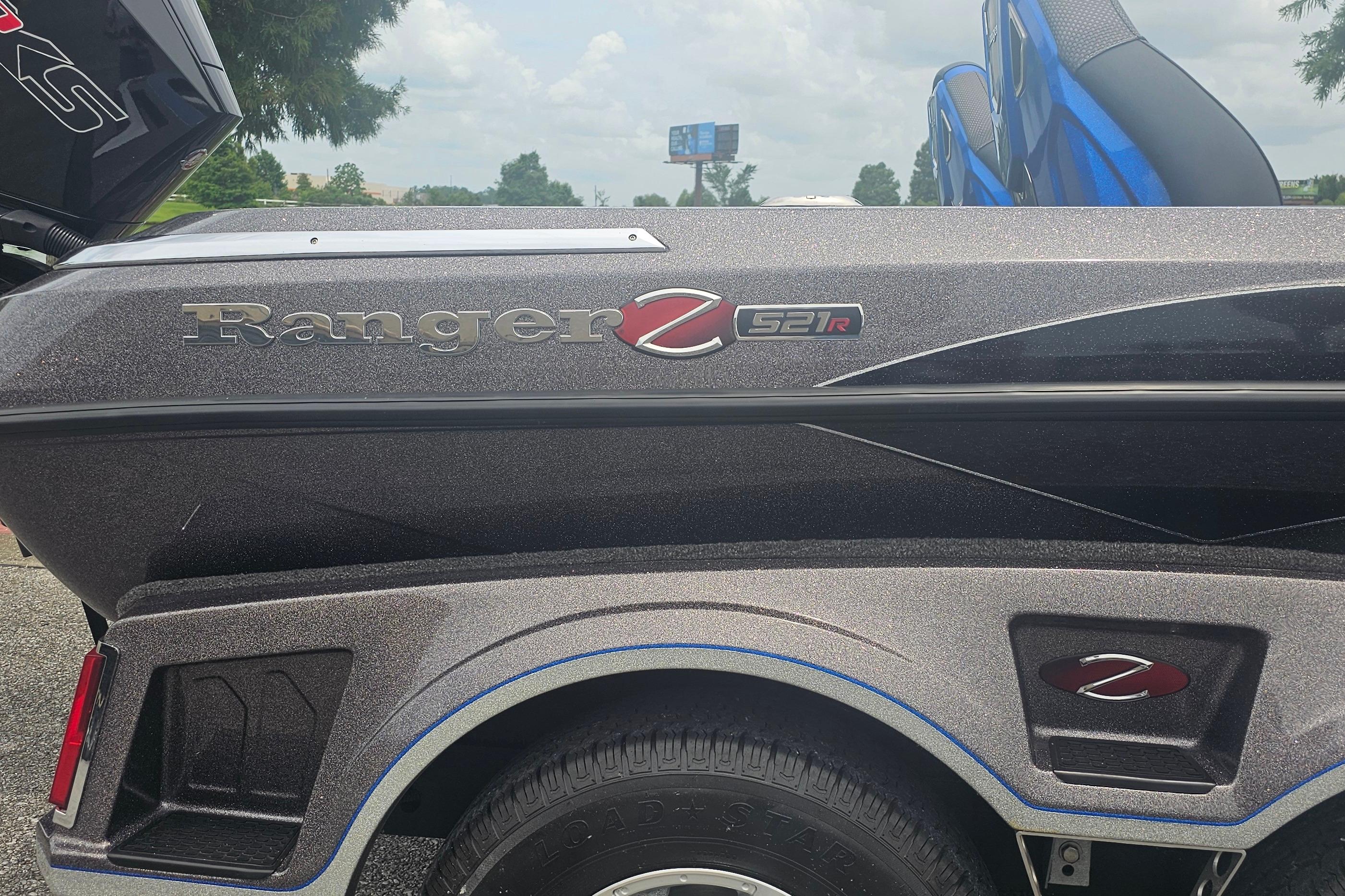 2024 Ranger Z521R boat, sleek design with logo, parked outdoors.