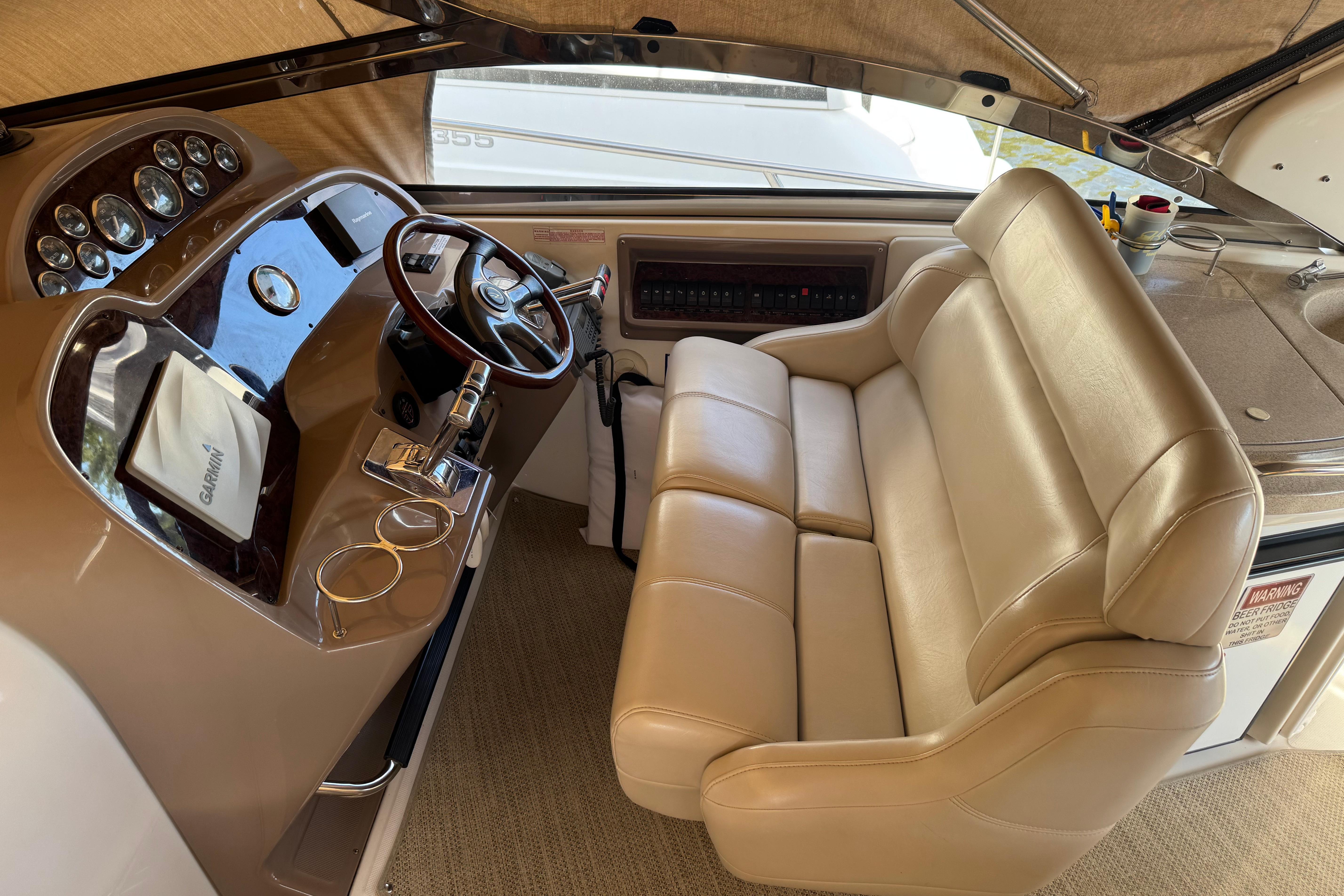 2007 Regal Commodore 3860 helm with leather seating and modern navigation controls.