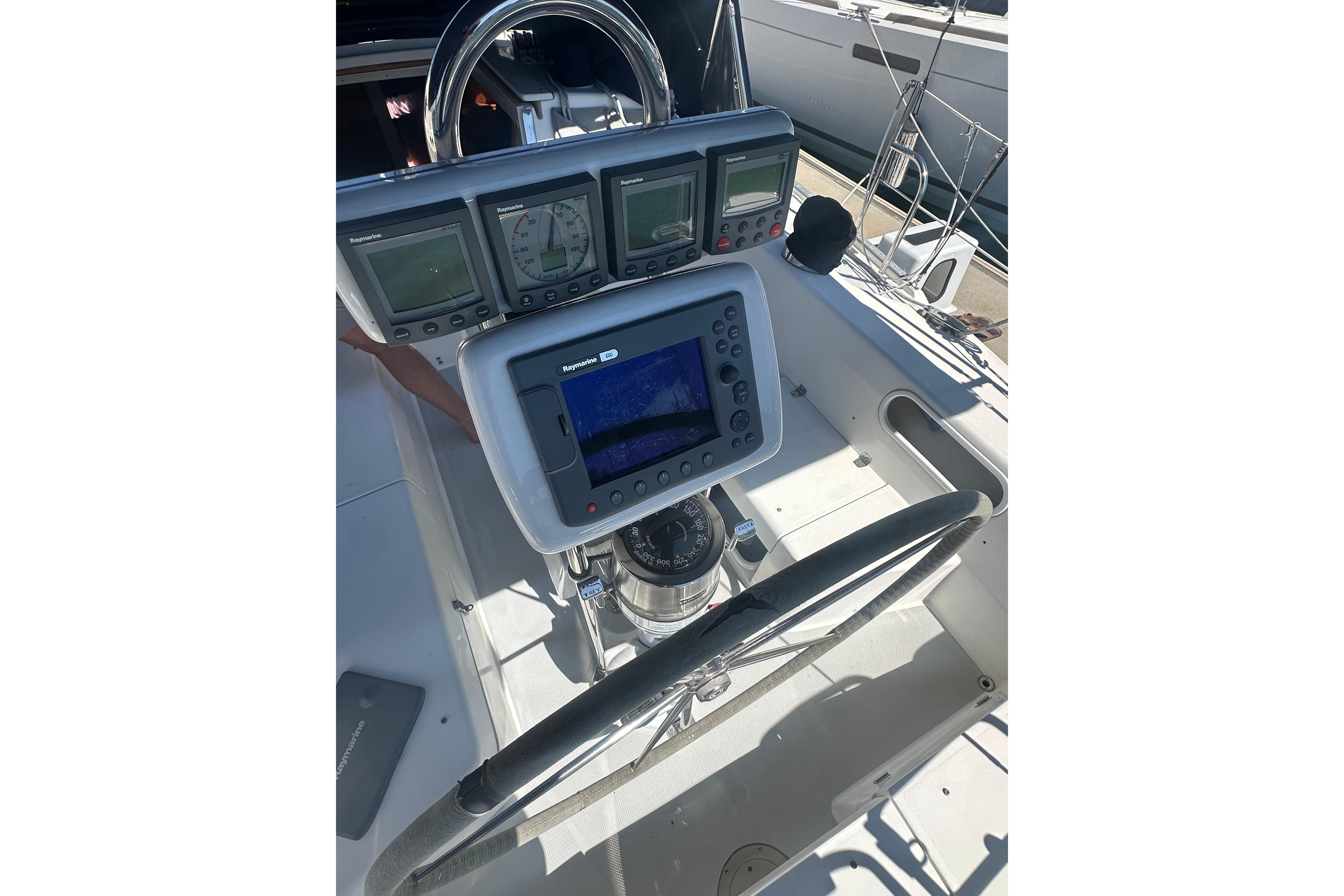 Cockpit of 2005 Catalina 36 MkII sailboat with navigation instruments and steering wheel.
