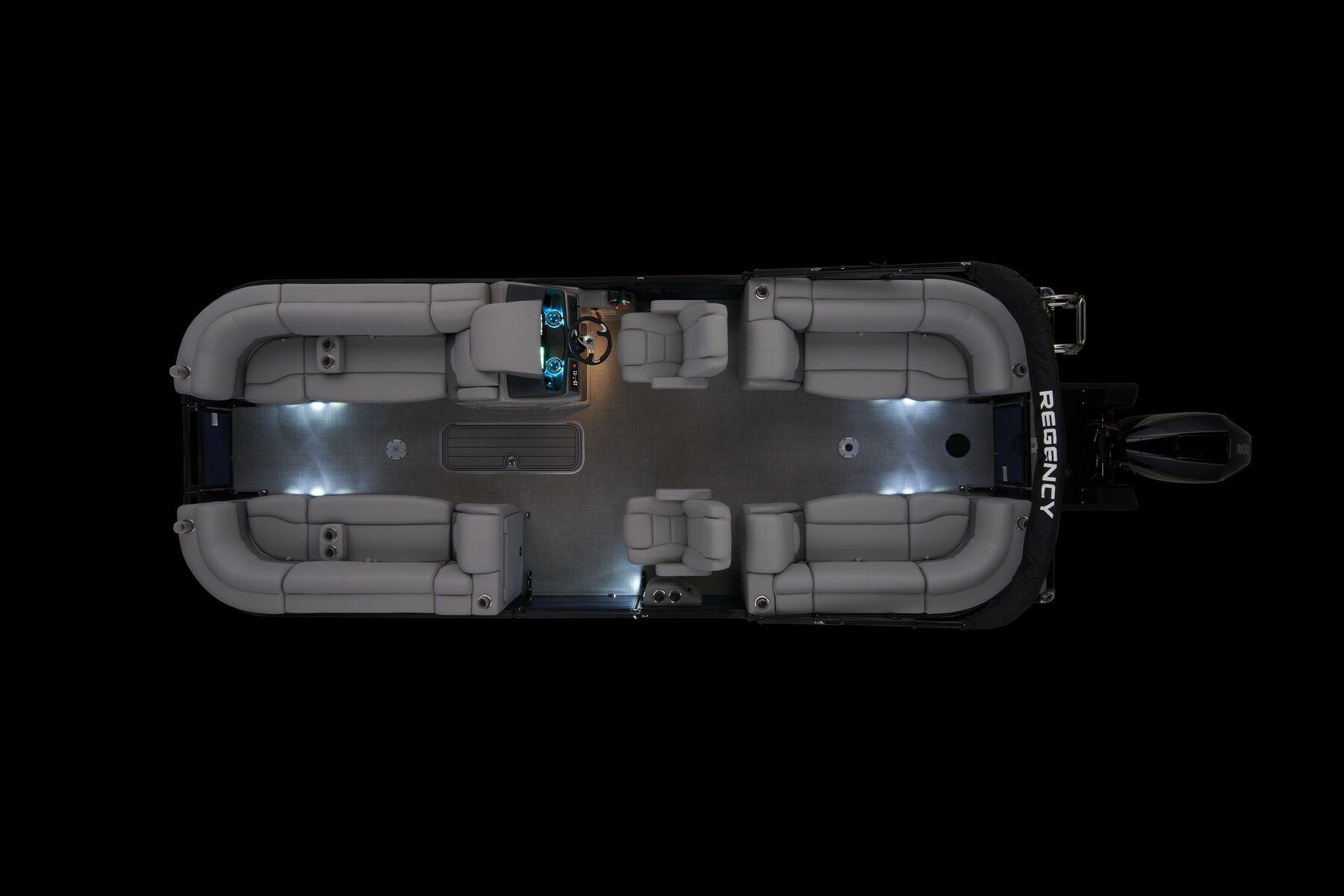 2026 Regency 230 DL pontoon boat interior with ambient lighting, top view.