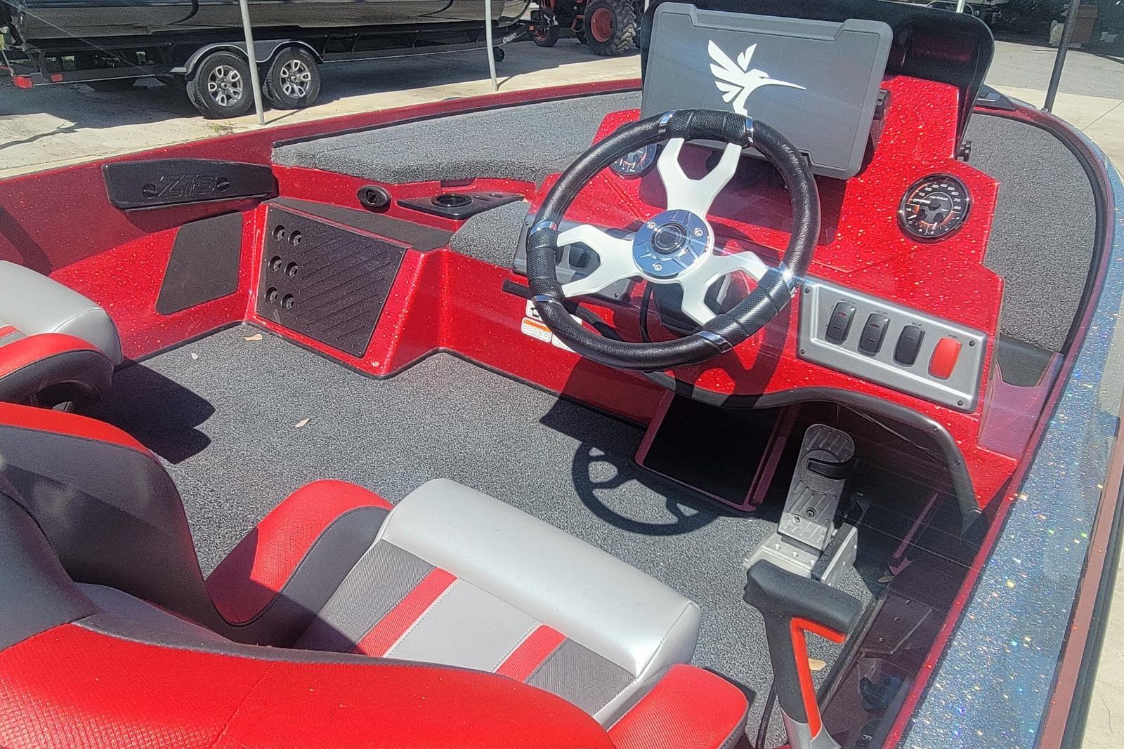 Interior of a 2026 Nitro Z18 boat with red and gray seating.
