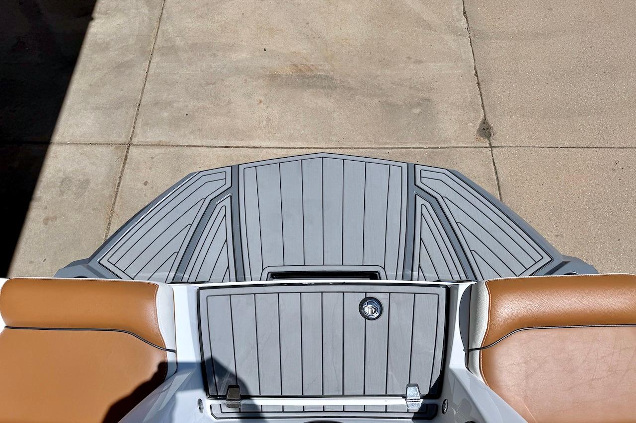 2021 Nautique Super Air Nautique G23 swim platform with gray decking and tan seating.
