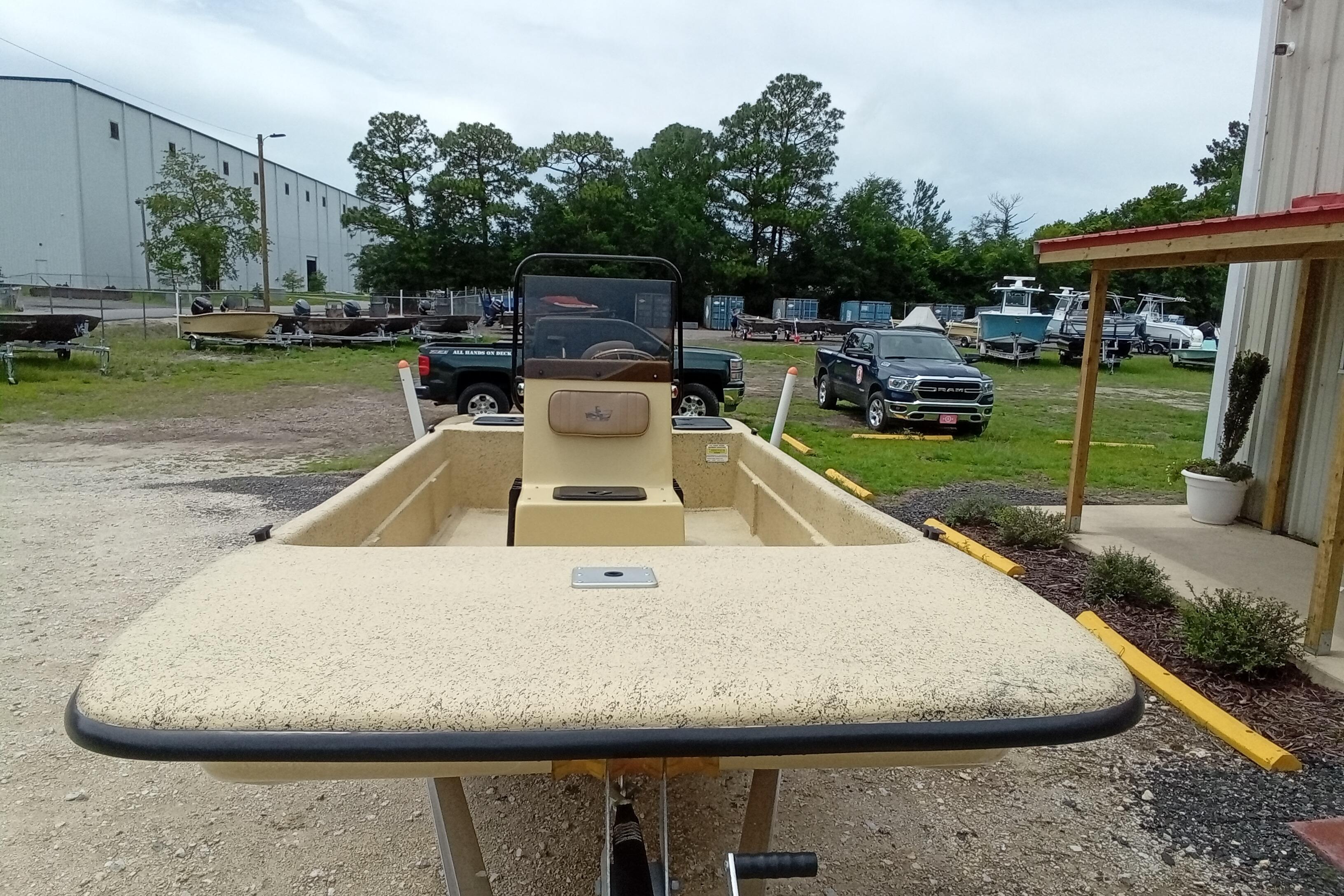 2025 Fibercraft F17 boat on trailer in outdoor storage area.