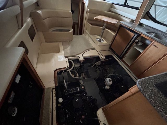 Interior of a 2004 Meridian 341 Sedan with open engine compartment.
