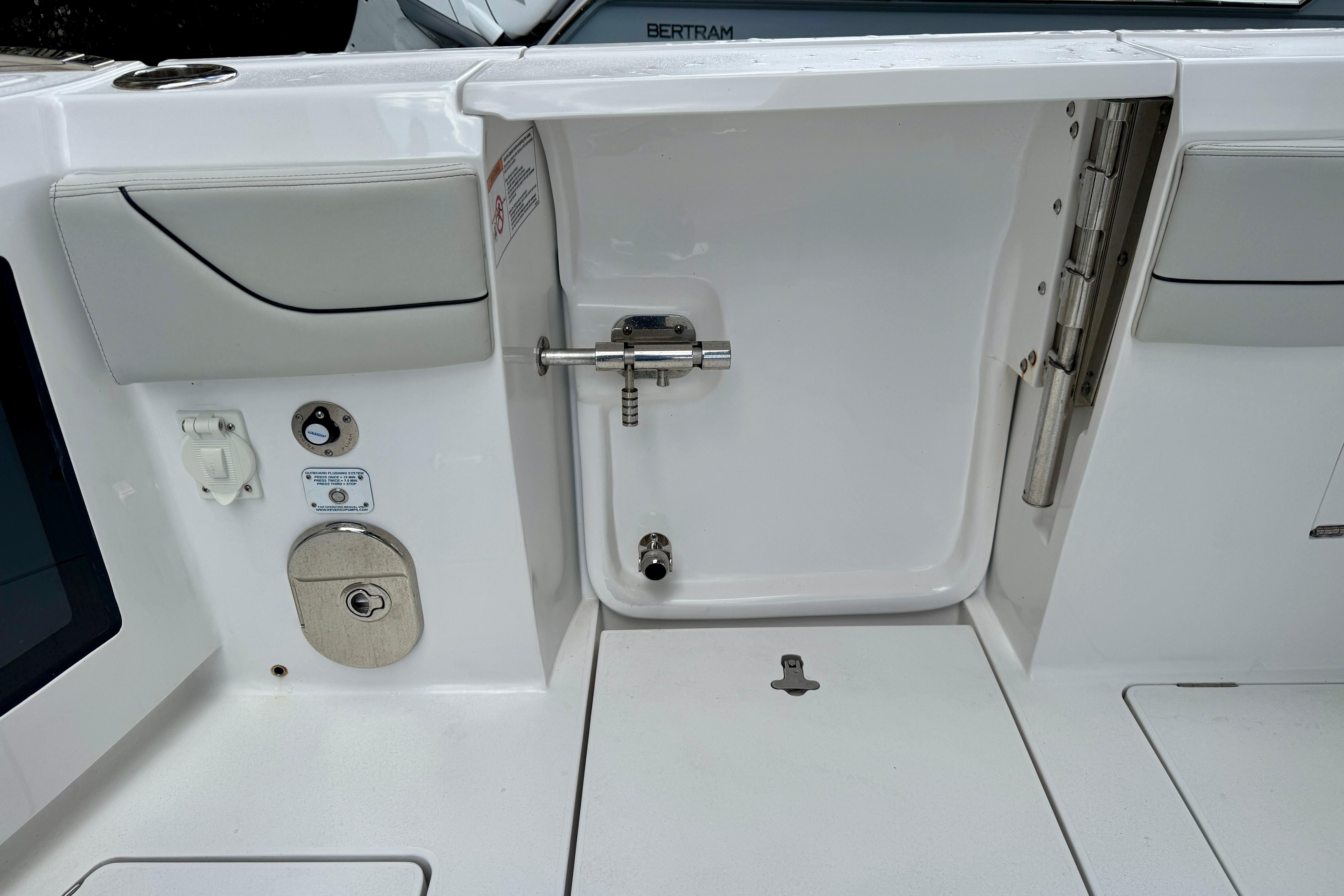 2024 Intrepid 427 Nomad SE boat interior, featuring a sleek white design and modern fittings.