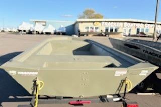 2026 Tracker Grizzly 1860 Utility boat at dealership, sunny day.