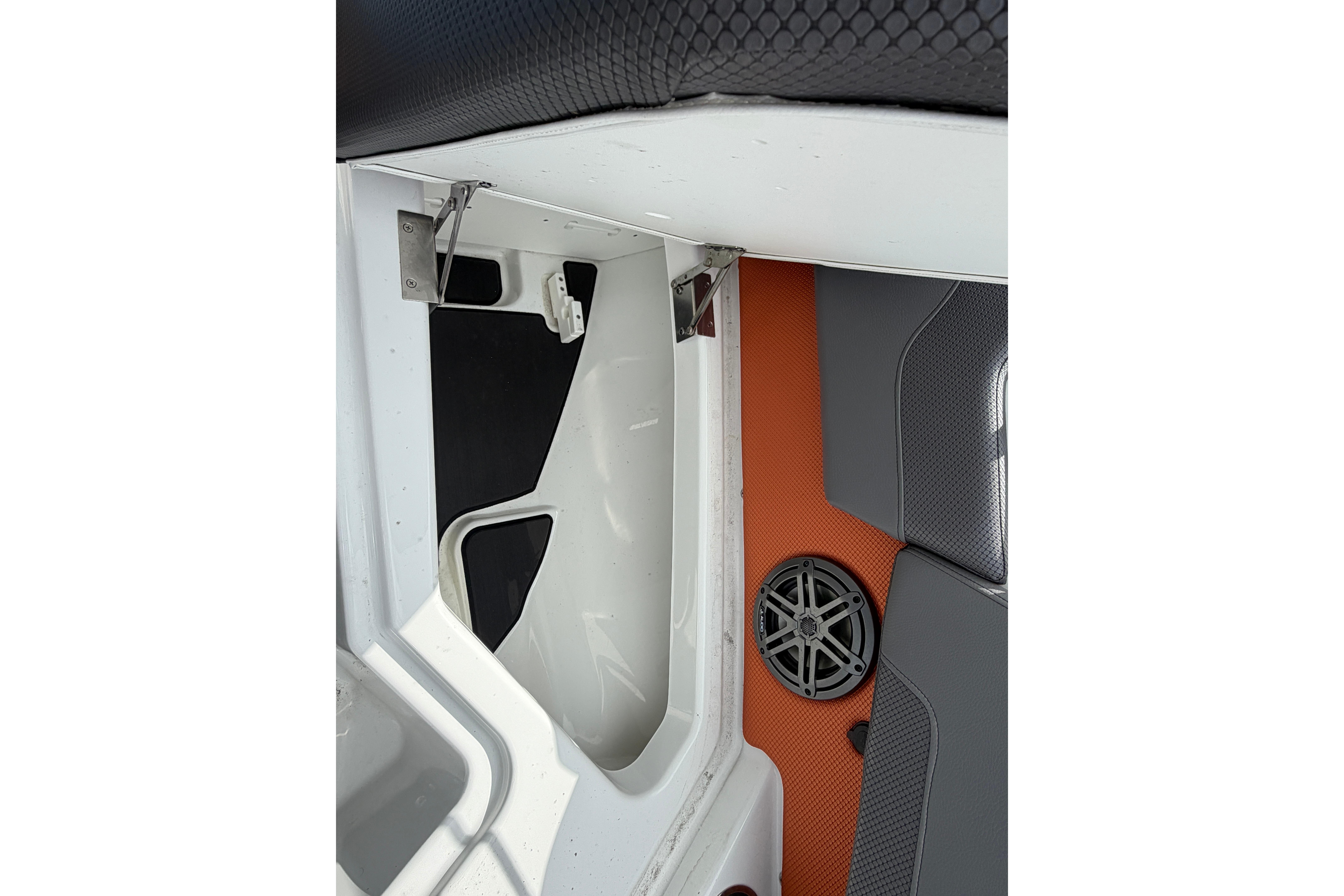 Interior view of 2026 Scarab 235 LX boat, featuring seating and speaker details.