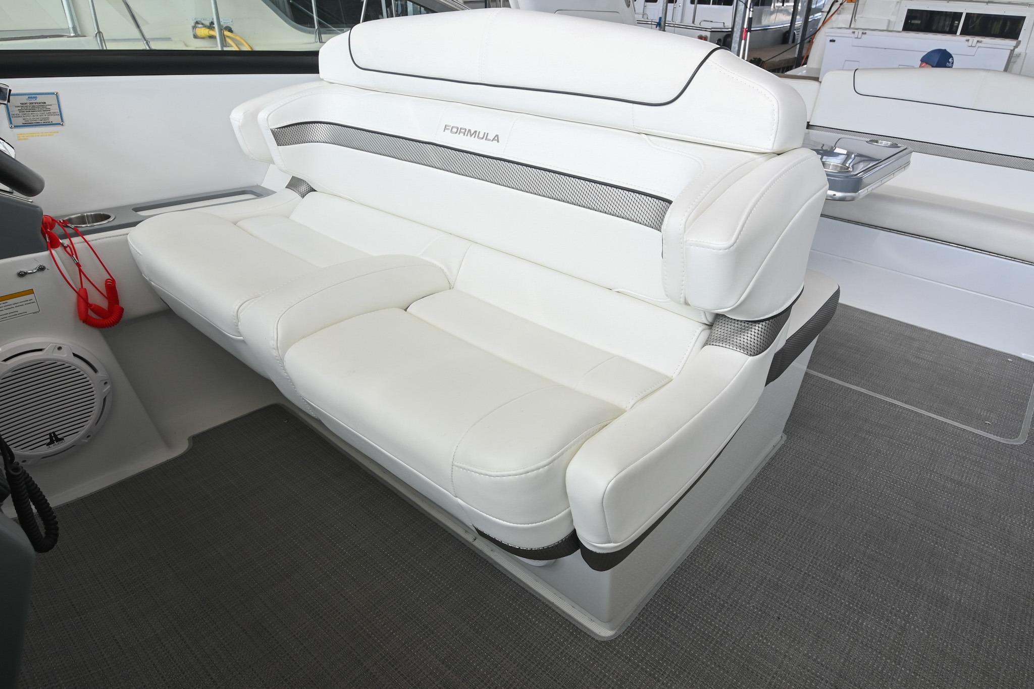 2014 Formula 350 Sun Sport boat interior with white leather seating.