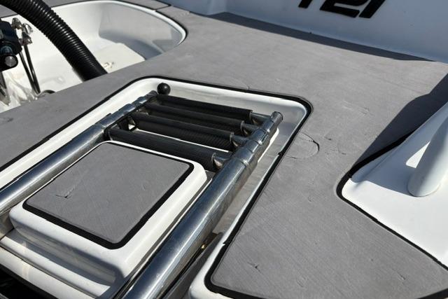 2024 Tahoe T21 boat with a sleek, integrated swim ladder on the deck.