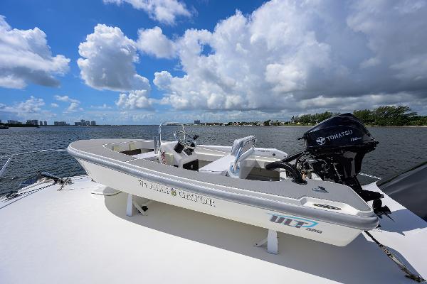Small boat on a Viking 50 Convertible yacht, 2000 model, with Tohatsu outboard motor.