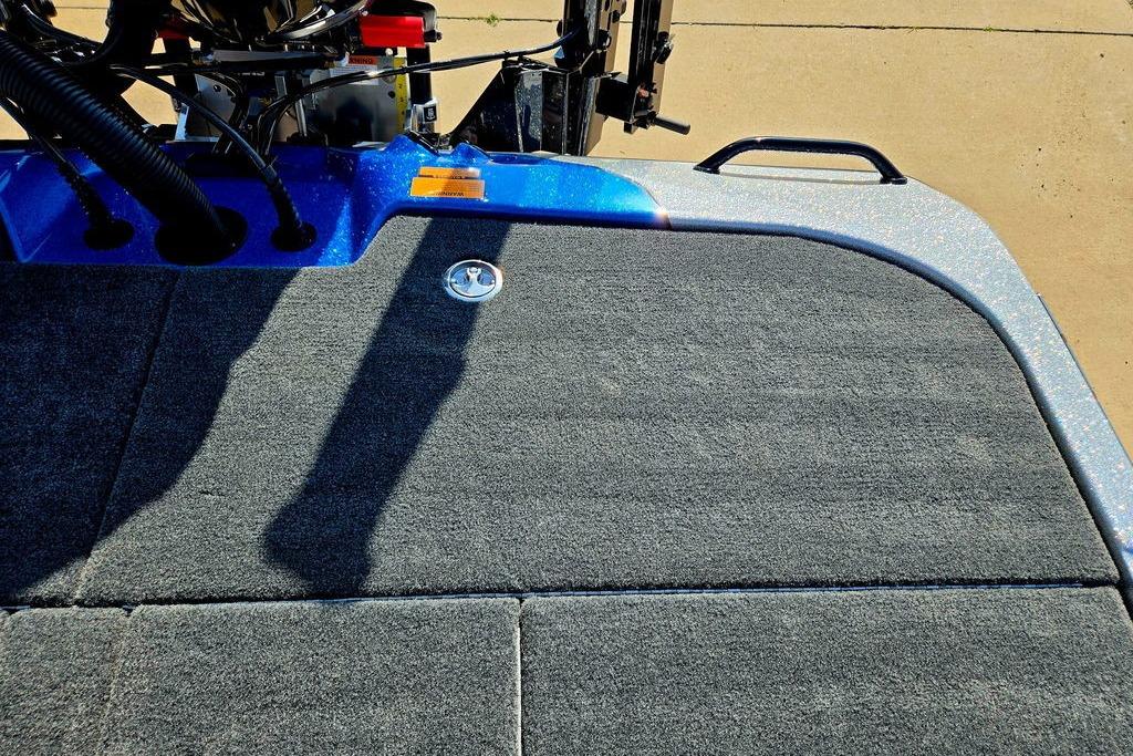 Rear deck of 2026 Skeeter ZXE20 boat with carpeted surface and motor components.