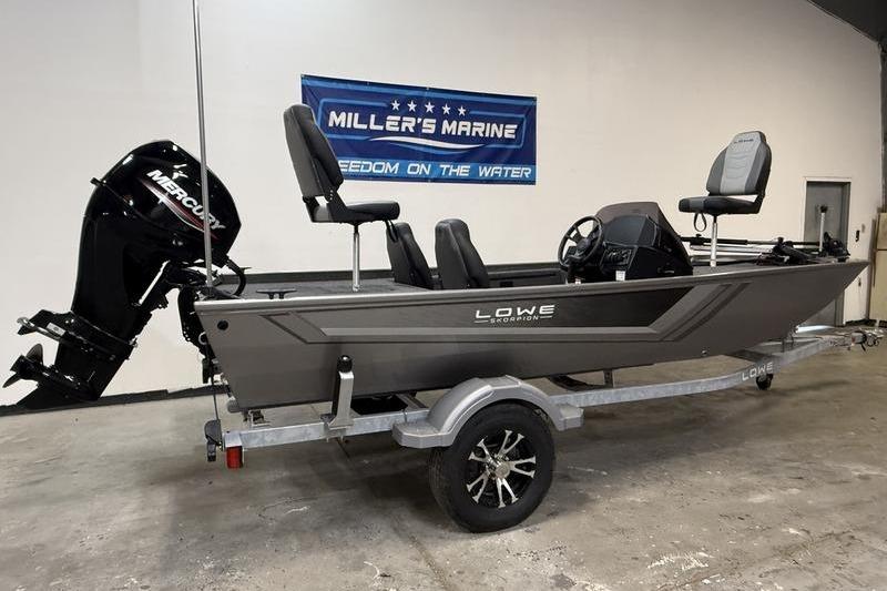 2026 Lowe Skorpion 16 fishing boat on trailer, displayed indoors at Miller's Marine.