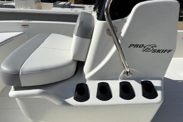 2026 Mako Pro Skiff 15 CC boat seat and console with rod holders.