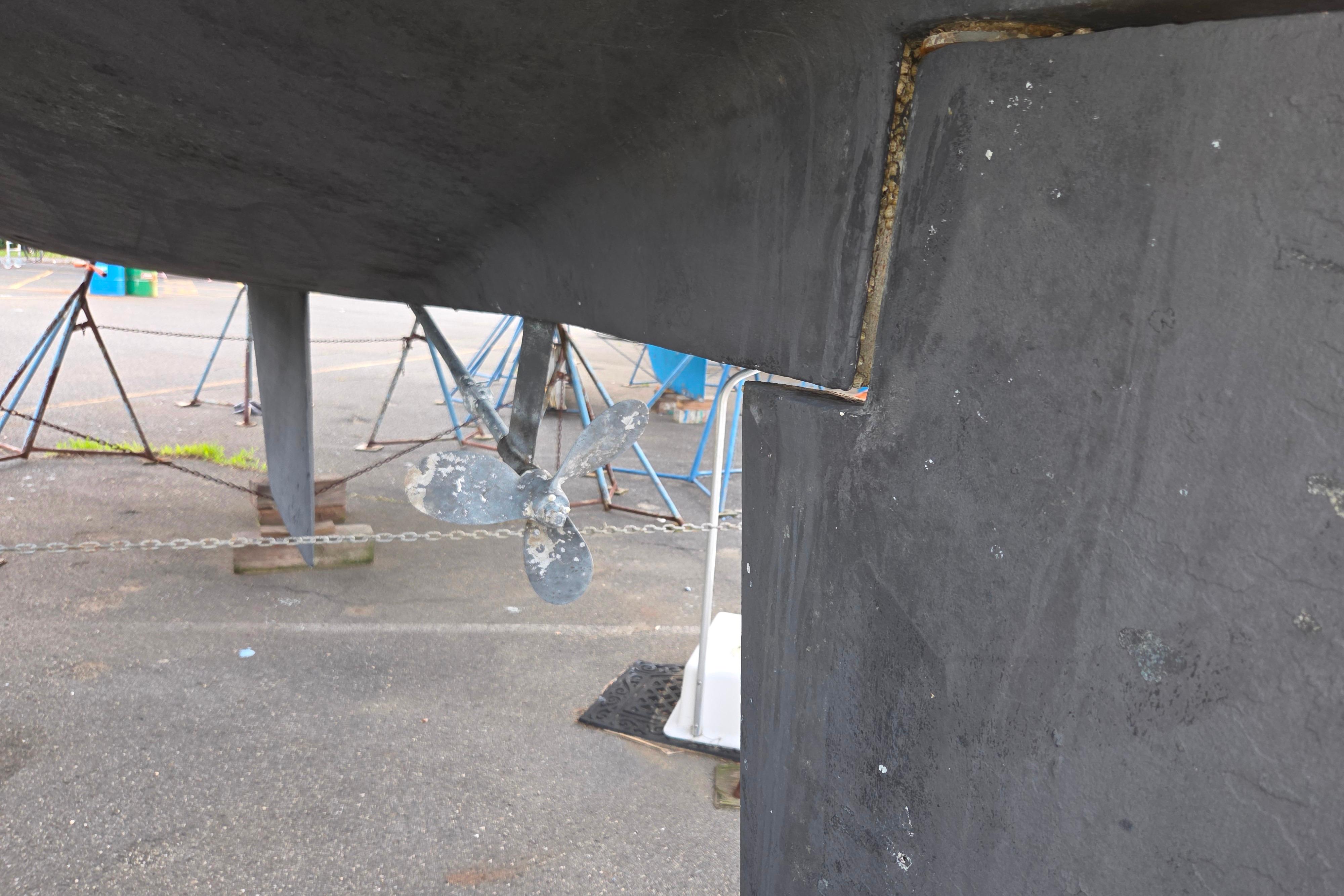 Catalina 355 sailboat propeller and rudder detail, 1986 model, on dry dock.