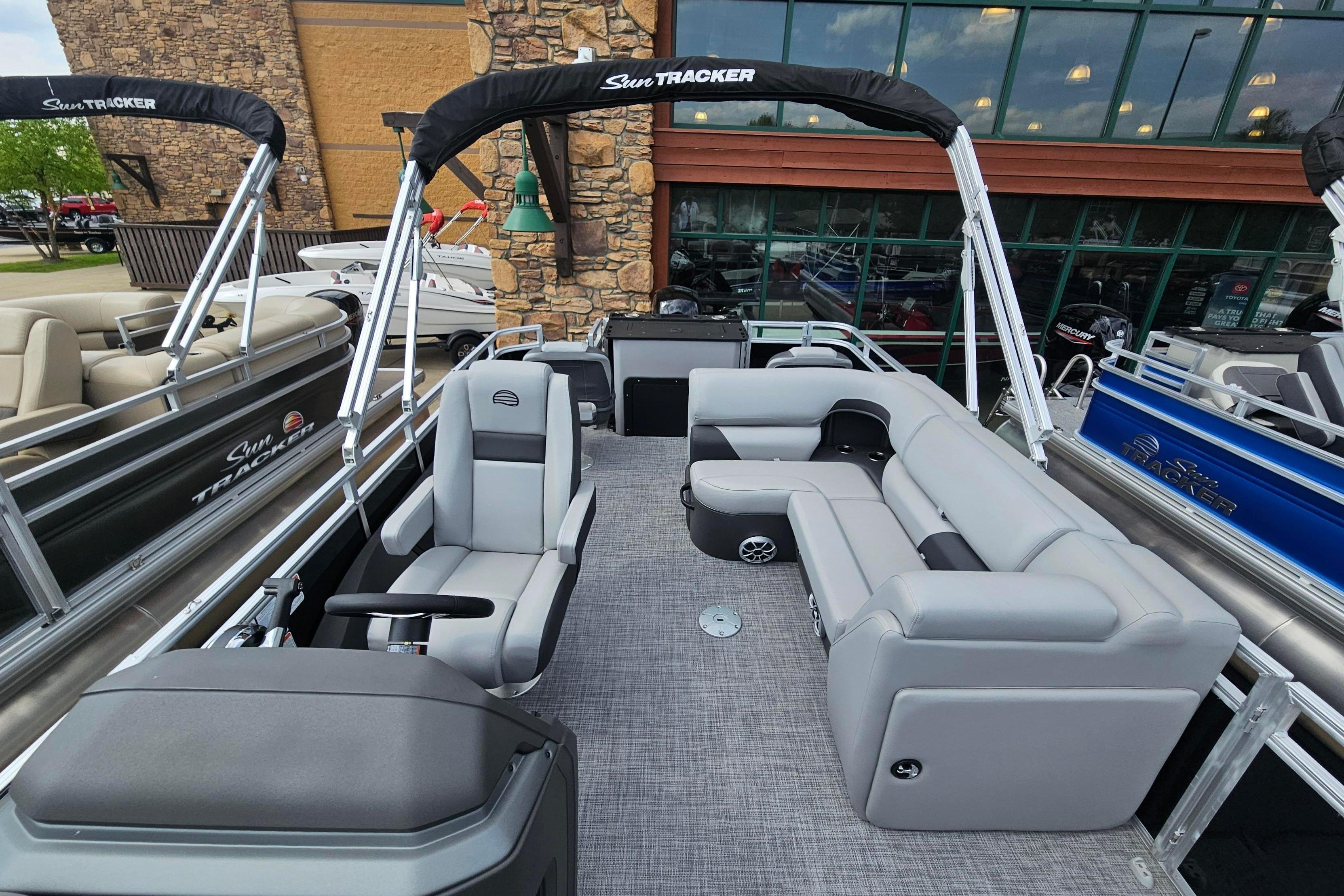 2026 Sun Tracker SportFish 22 DLX pontoon boat with spacious seating and modern design.