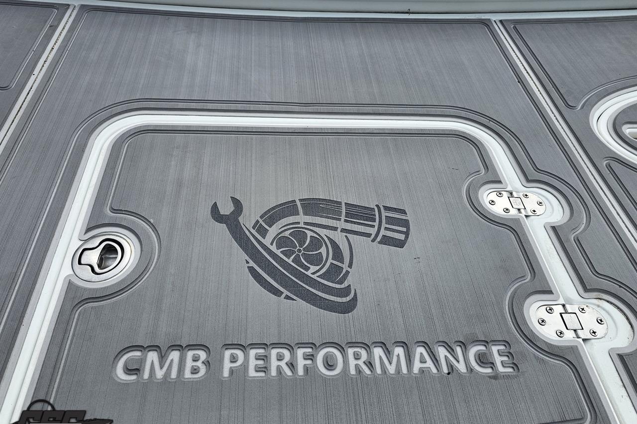 2008 Baja 335 Performance boat deck with CMB Performance logo and hatch details.
