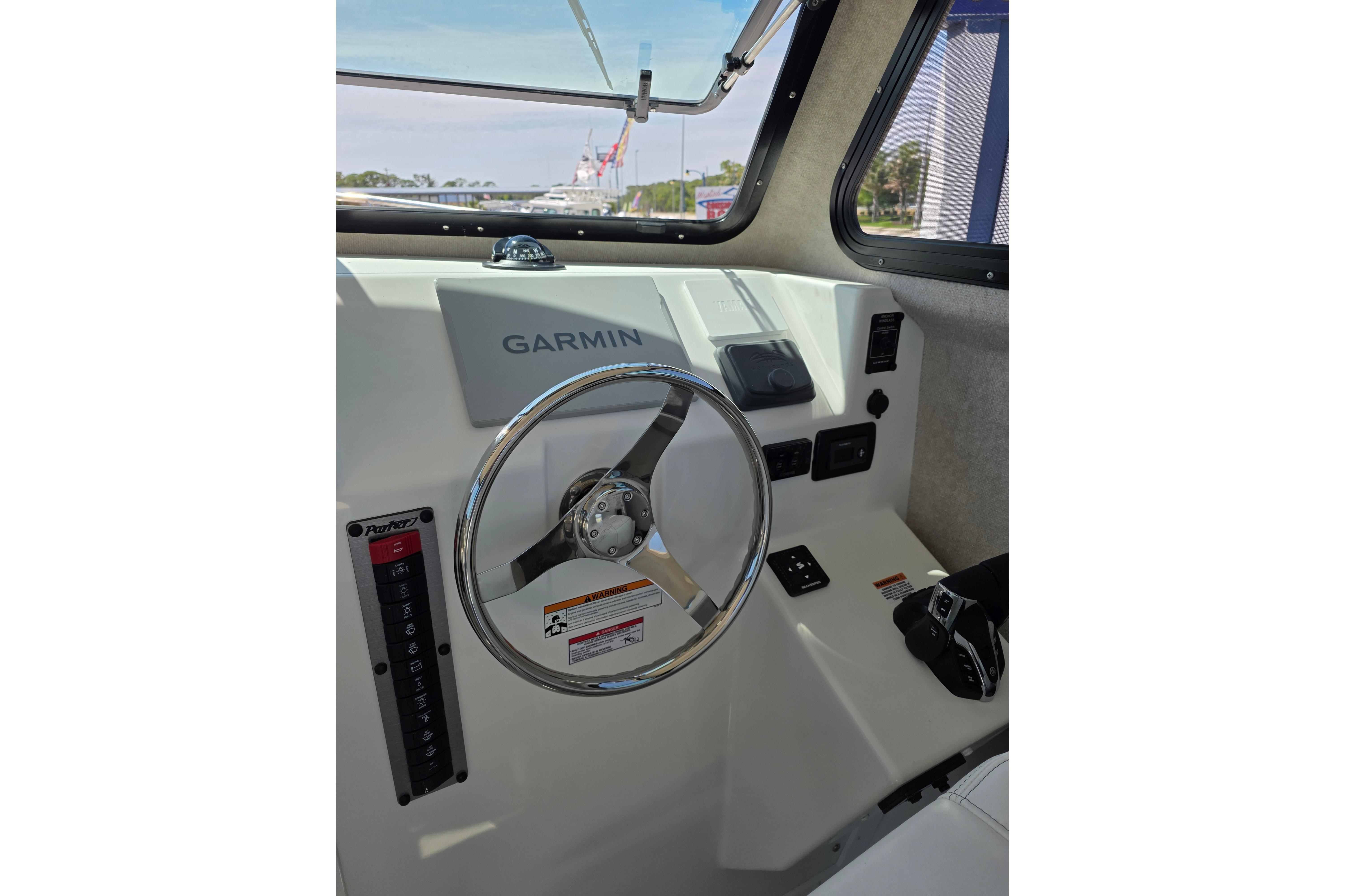 Helm of 2026 Parker 287 Explorer boat with Garmin navigation system.