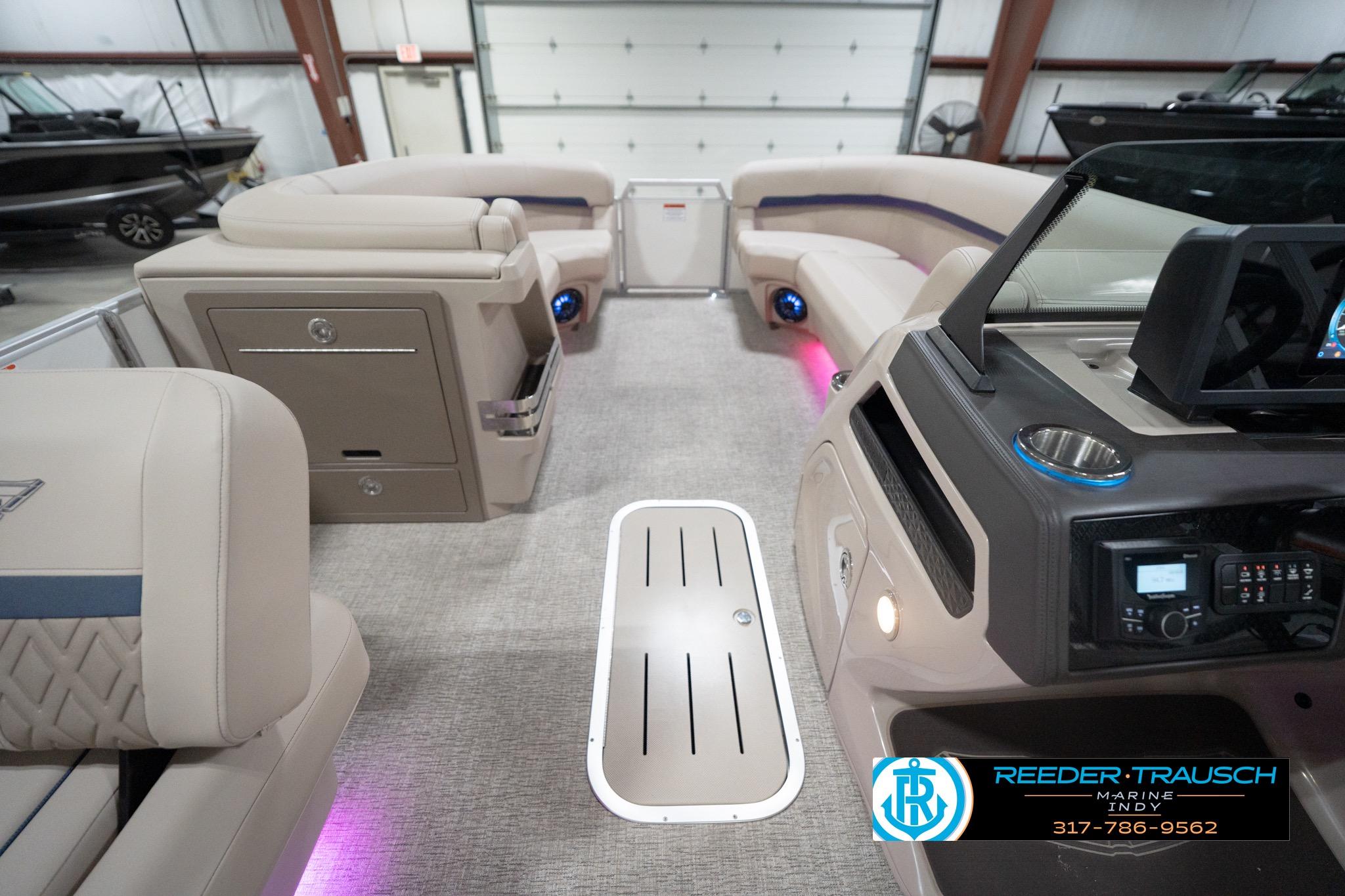 Interior of 2026 Bennington 22 ML pontoon boat with modern seating and ambient lighting.
