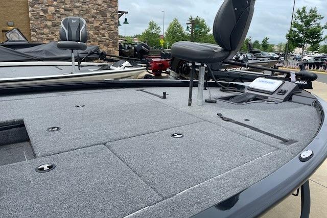 2025 Ranger ALPHA 208 fishing boat with spacious deck and seating, ideal for angling adventures.