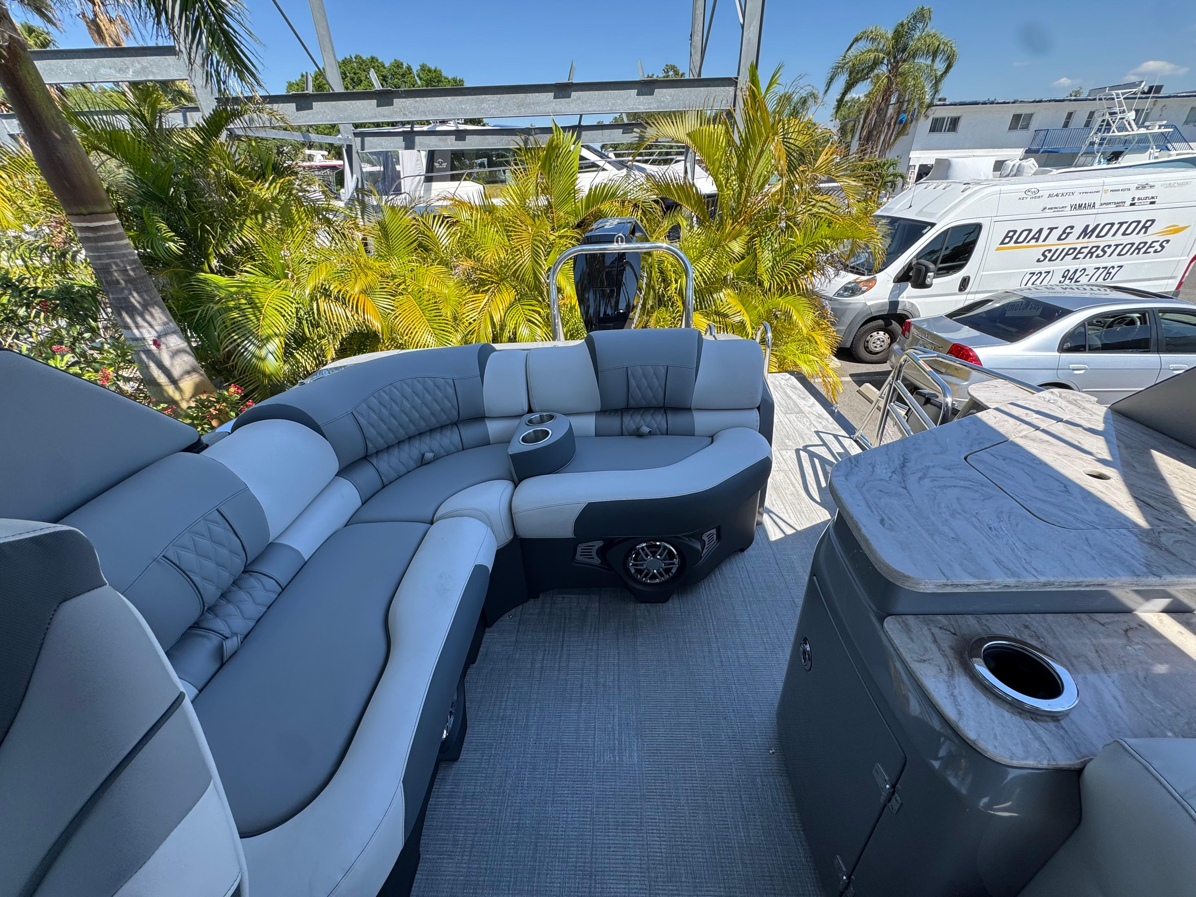 Luxurious 2025 Avalon Excalibur 27' boat interior with plush seating and modern amenities.