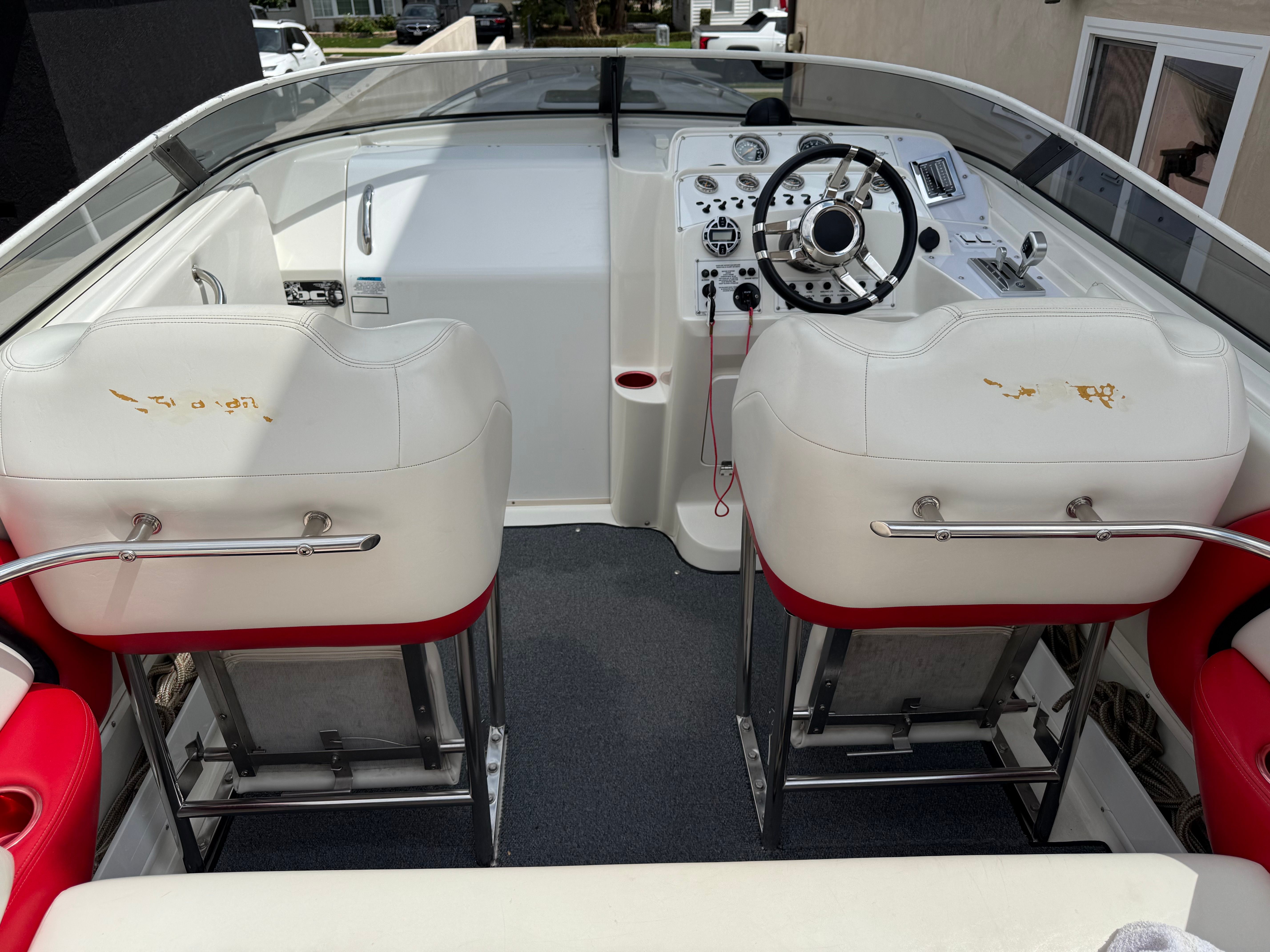 Interior of a 2001 Wellcraft 29 Scarab boat with white seats.