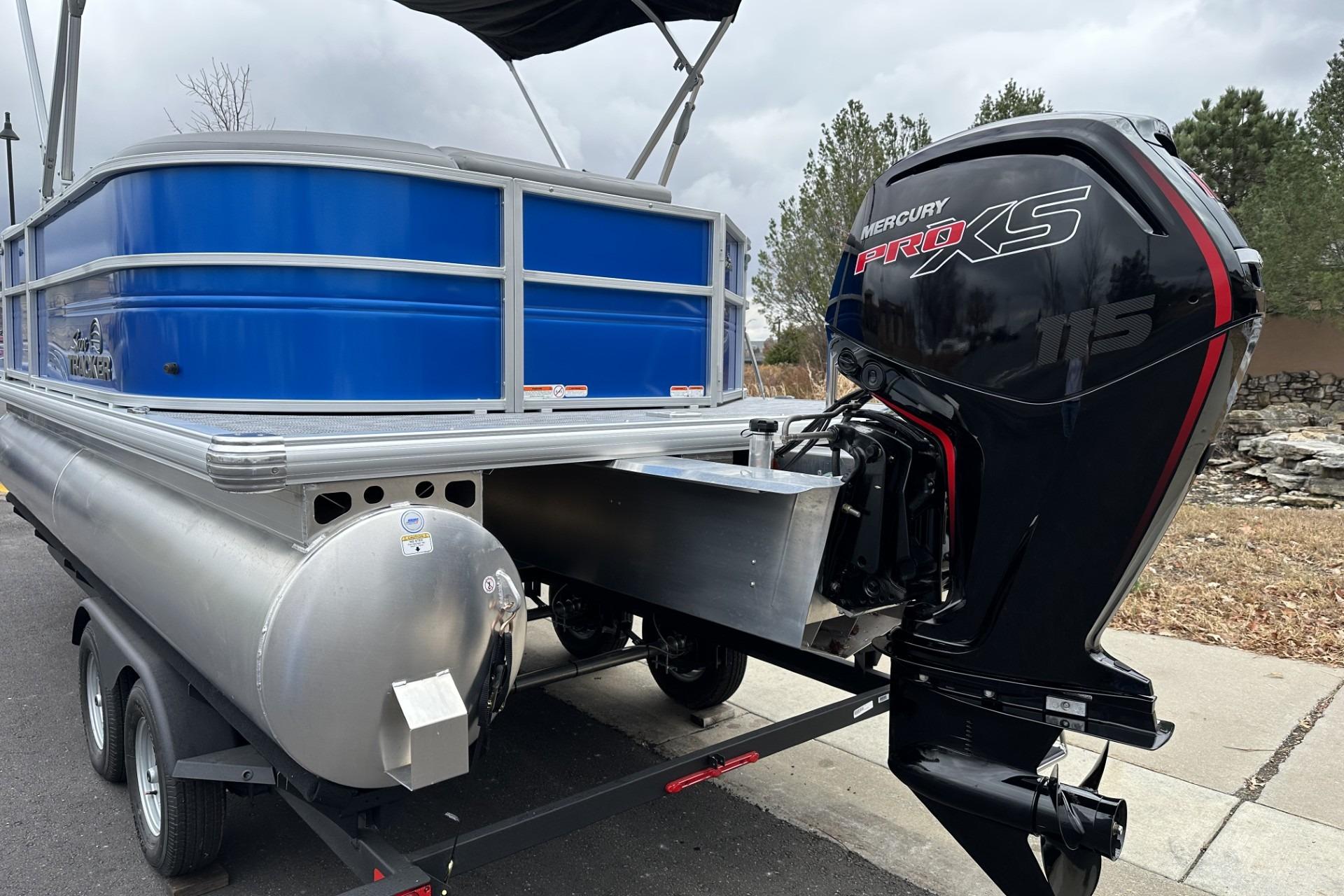 2026 Sun Tracker Party Barge 20 DLX with Mercury Pro XS 115 engine on trailer.