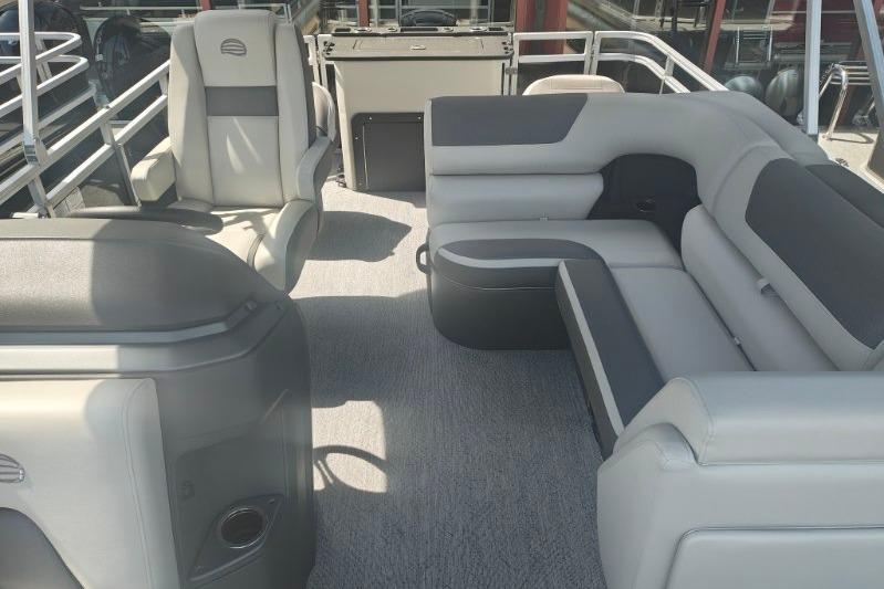 2026 Sun Tracker Fishin' Barge 20 DLX interior with plush seating and modern design.