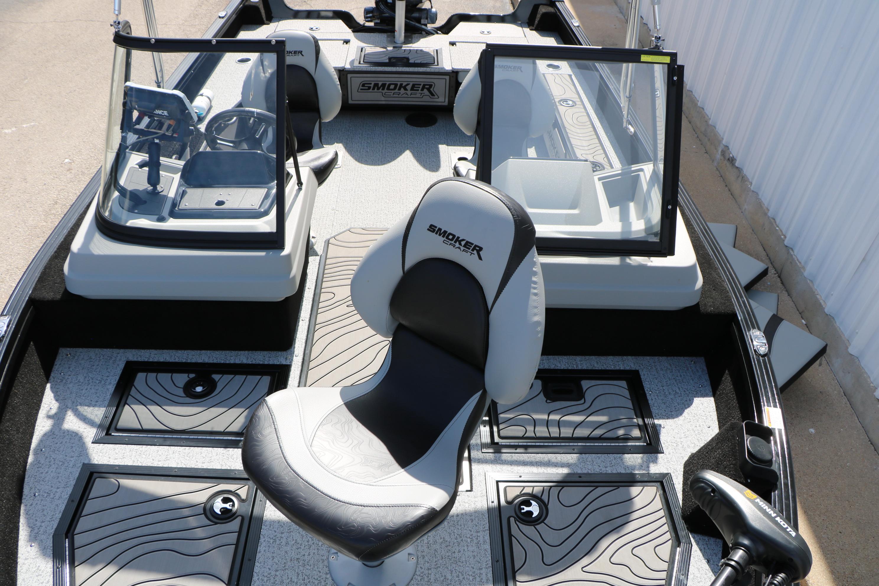 2025 Smoker Craft Adventurer 188 DC boat interior with seating and control panels.
