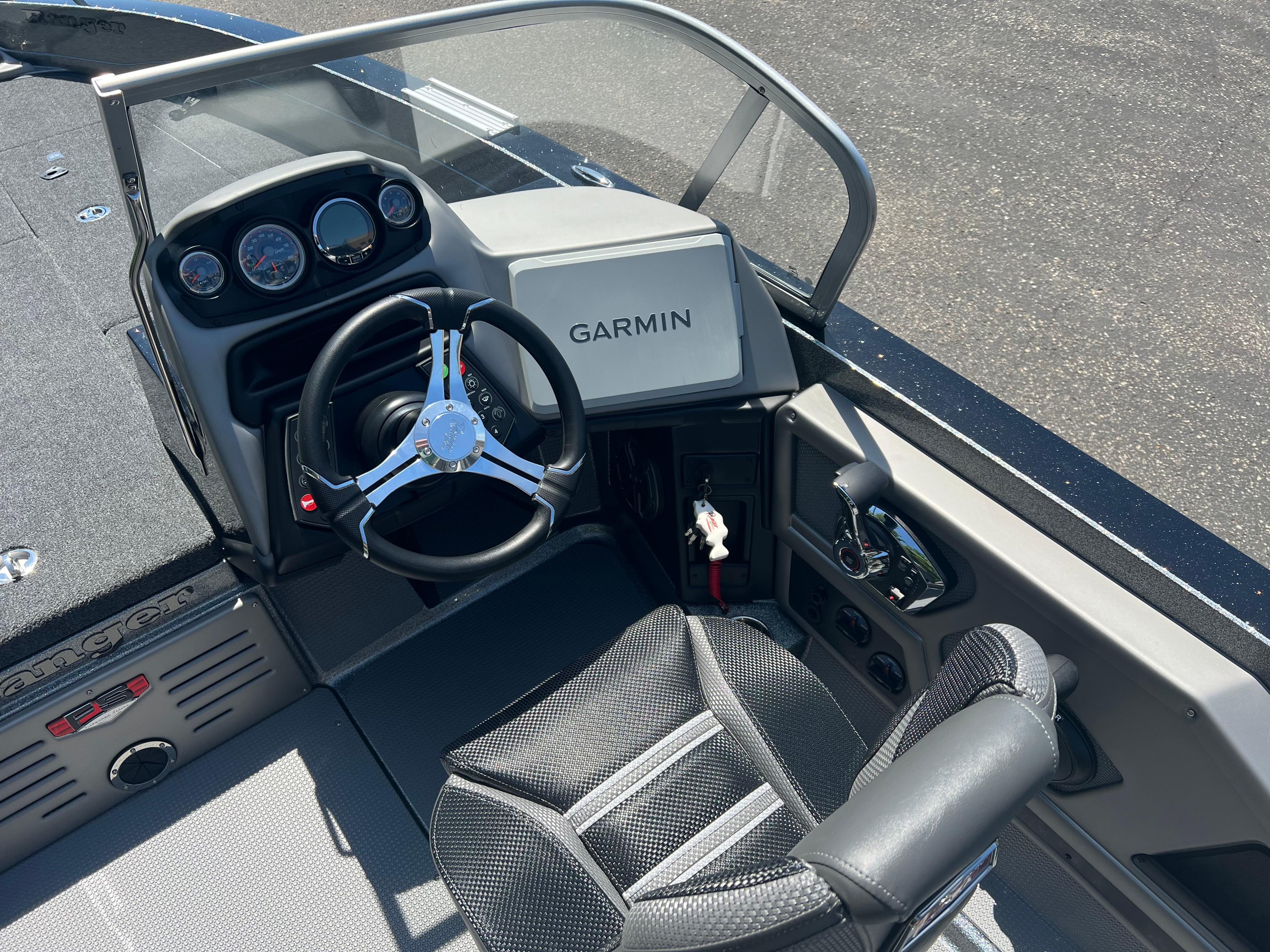 2025 Ranger 621FS Cup Equipped boat cockpit with Garmin navigation and steering wheel.