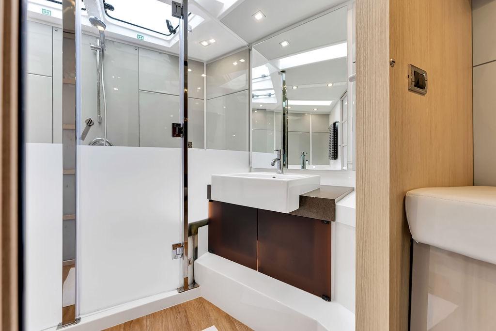 Luxurious bathroom interior of 2012 Fairline Targa 58 yacht, featuring modern fixtures and elegant design.