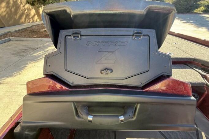 2026 Nitro Z21 XL Pro boat storage compartment with handle, outdoor setting.