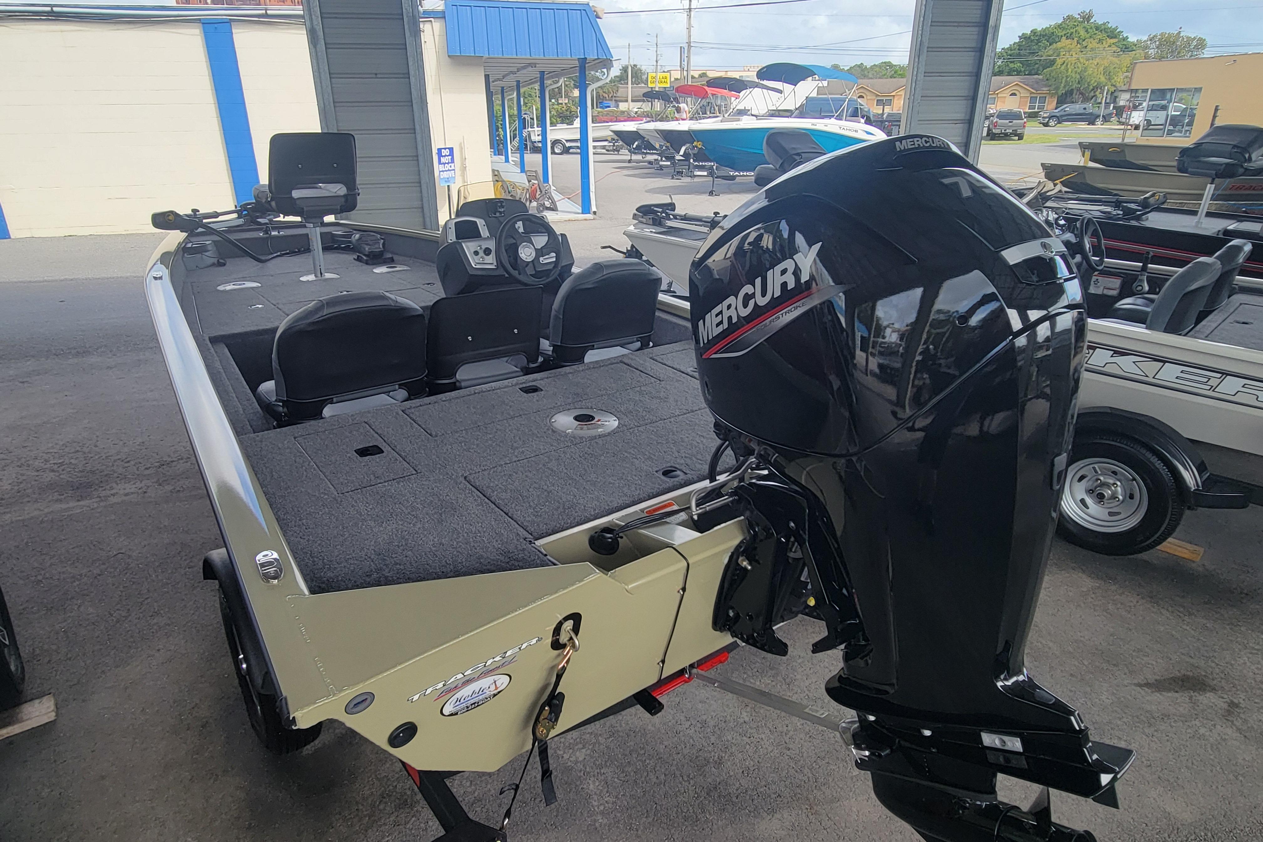 2026 Tracker Pro Team 175 Crappie Edition boat with Mercury engine in showroom.