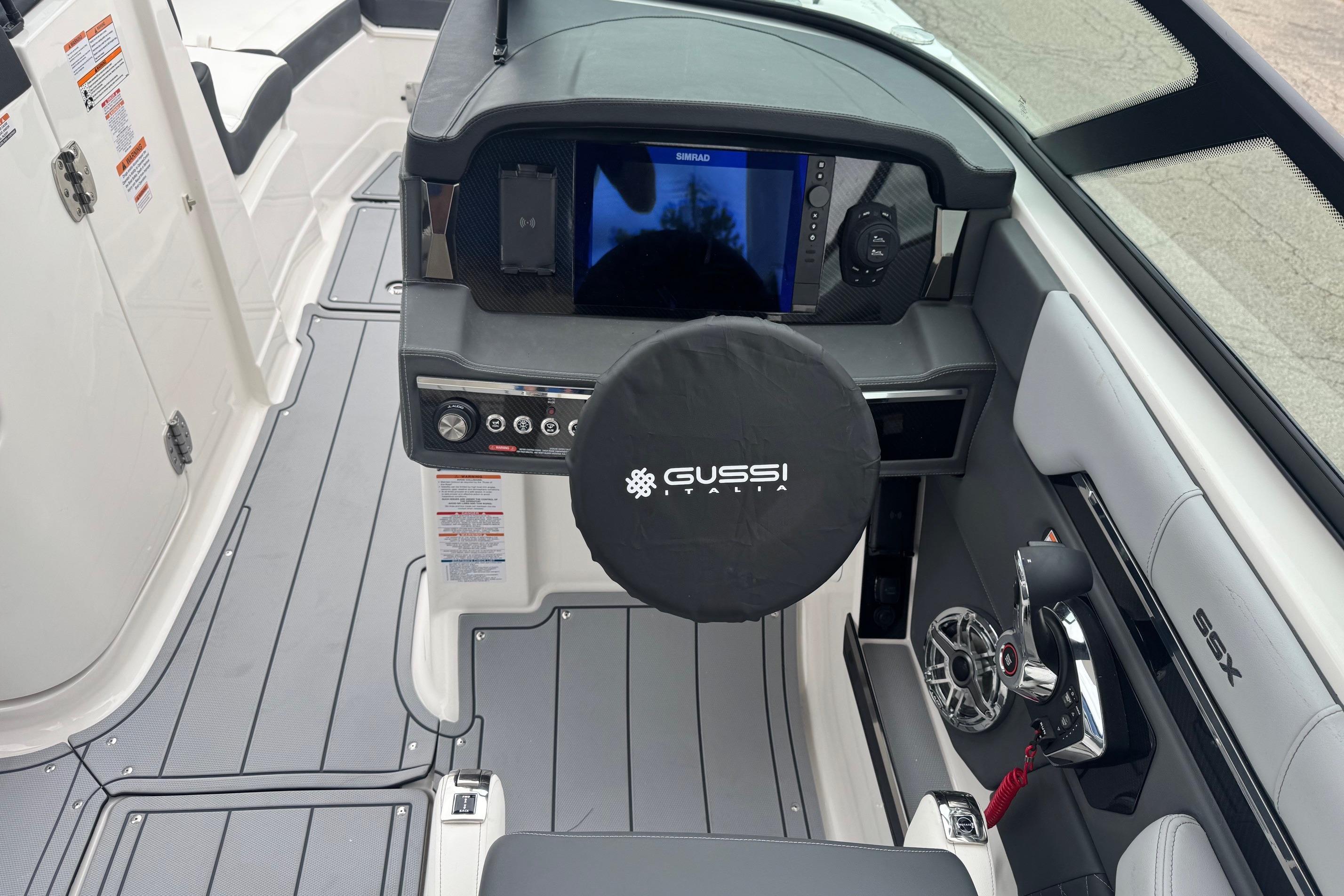 2026 Chaparral 8 SSX boat cockpit with Gussi Italia steering wheel and modern controls.