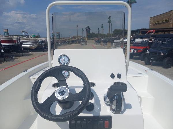 2024 Mako Pro Skiff 19 CC center console with steering wheel and controls.