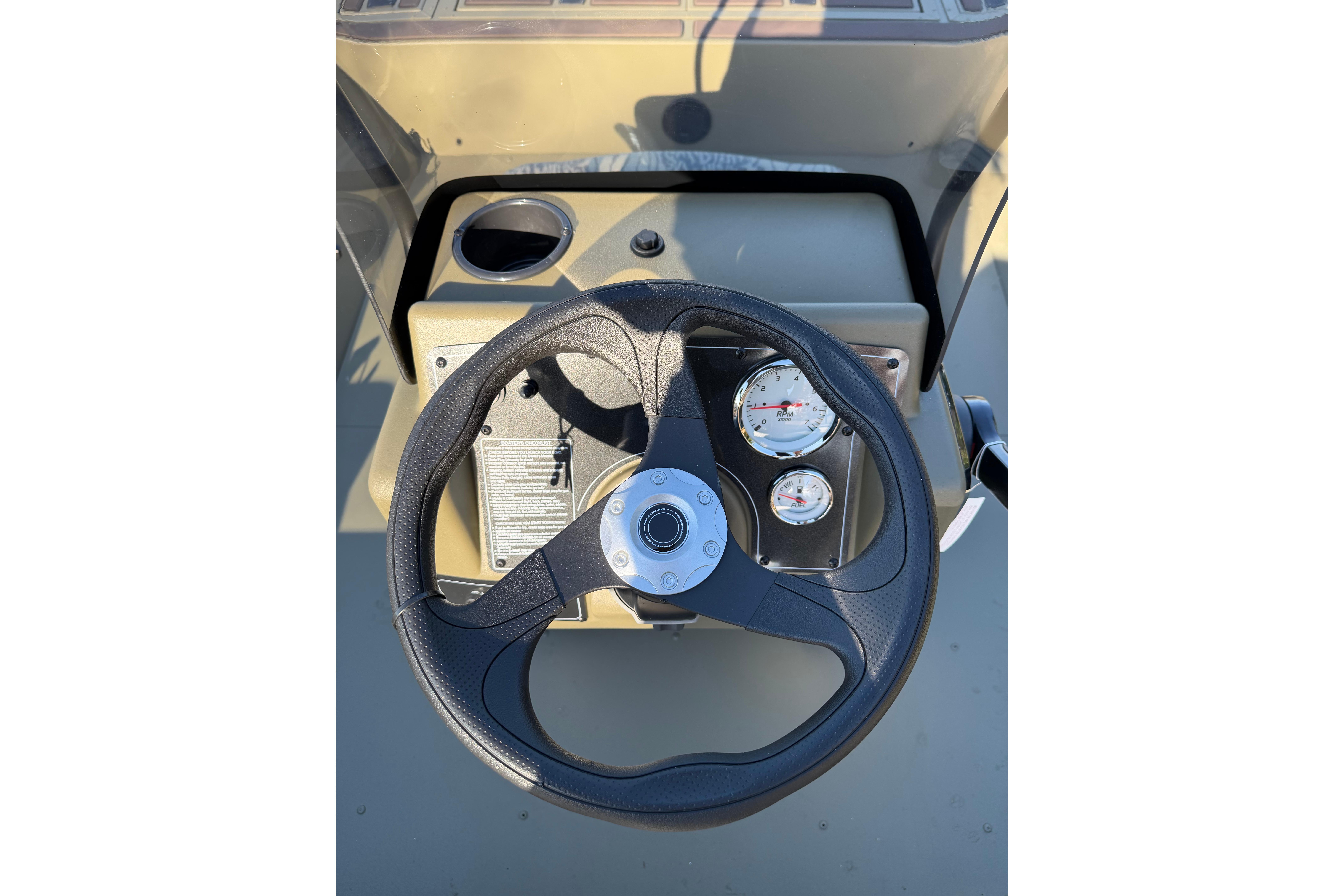 Steering wheel and gauges of 2026 Tracker Grizzly 2072 CC boat console.