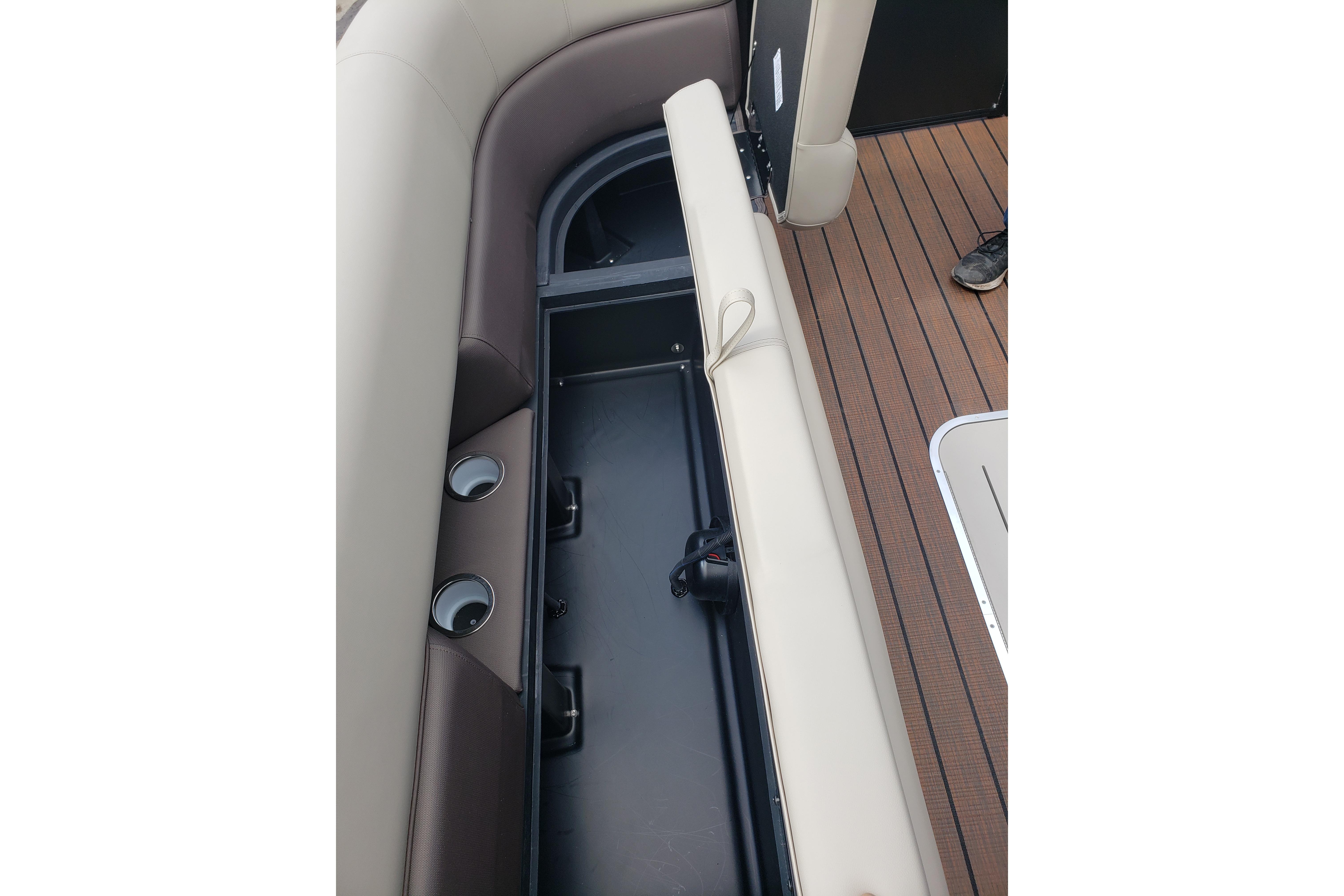 2026 Bentley Pontoons Elite 253 QSB interior storage compartment with cup holders and seating.