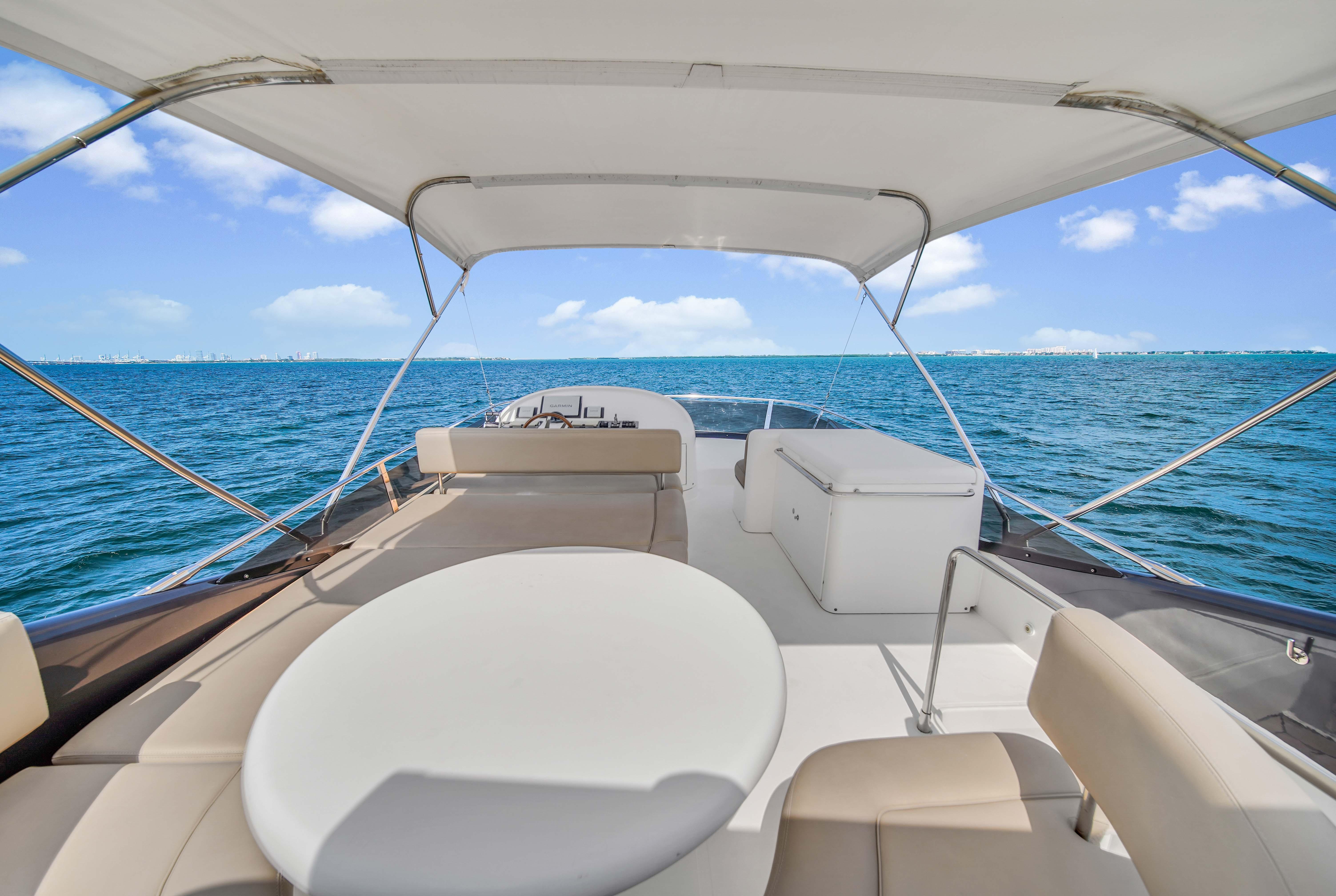 2006 Uniesse 58 yacht deck with ocean view and seating area.