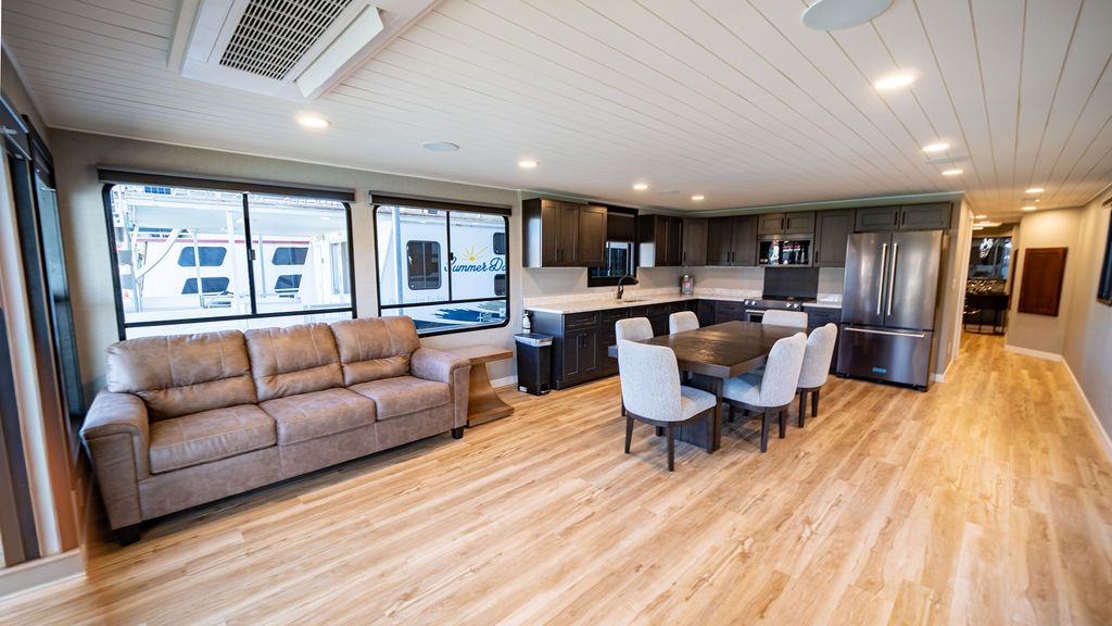 Interior of a 1999 Sumerset Widebody houseboat with modern kitchen and living area.