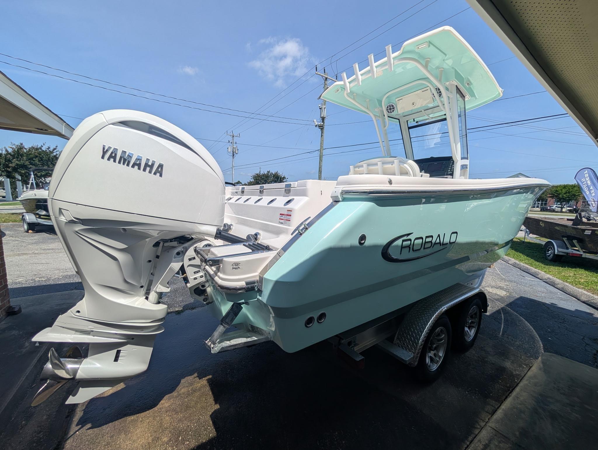 2025 Robalo R250 Center Console boat with Yamaha engine on trailer.