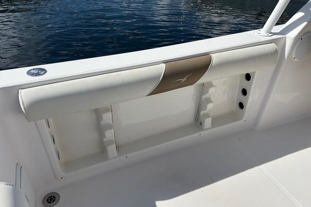 2018 Pro-Line 23 Dual Console boat interior with white seating and storage compartment.
