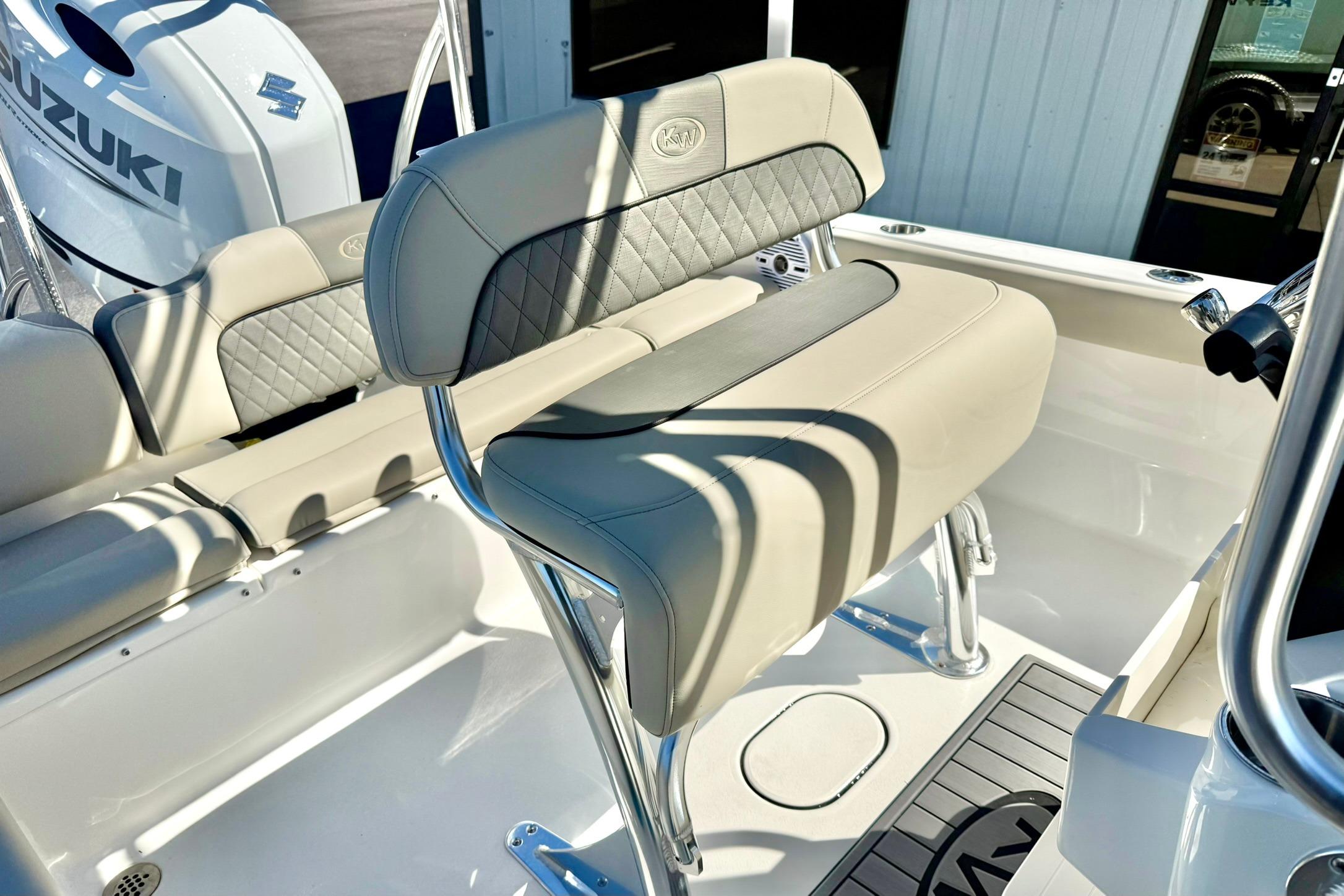 2026 Key West 189 FS boat interior with Suzuki engine, featuring cushioned seating and sleek design.