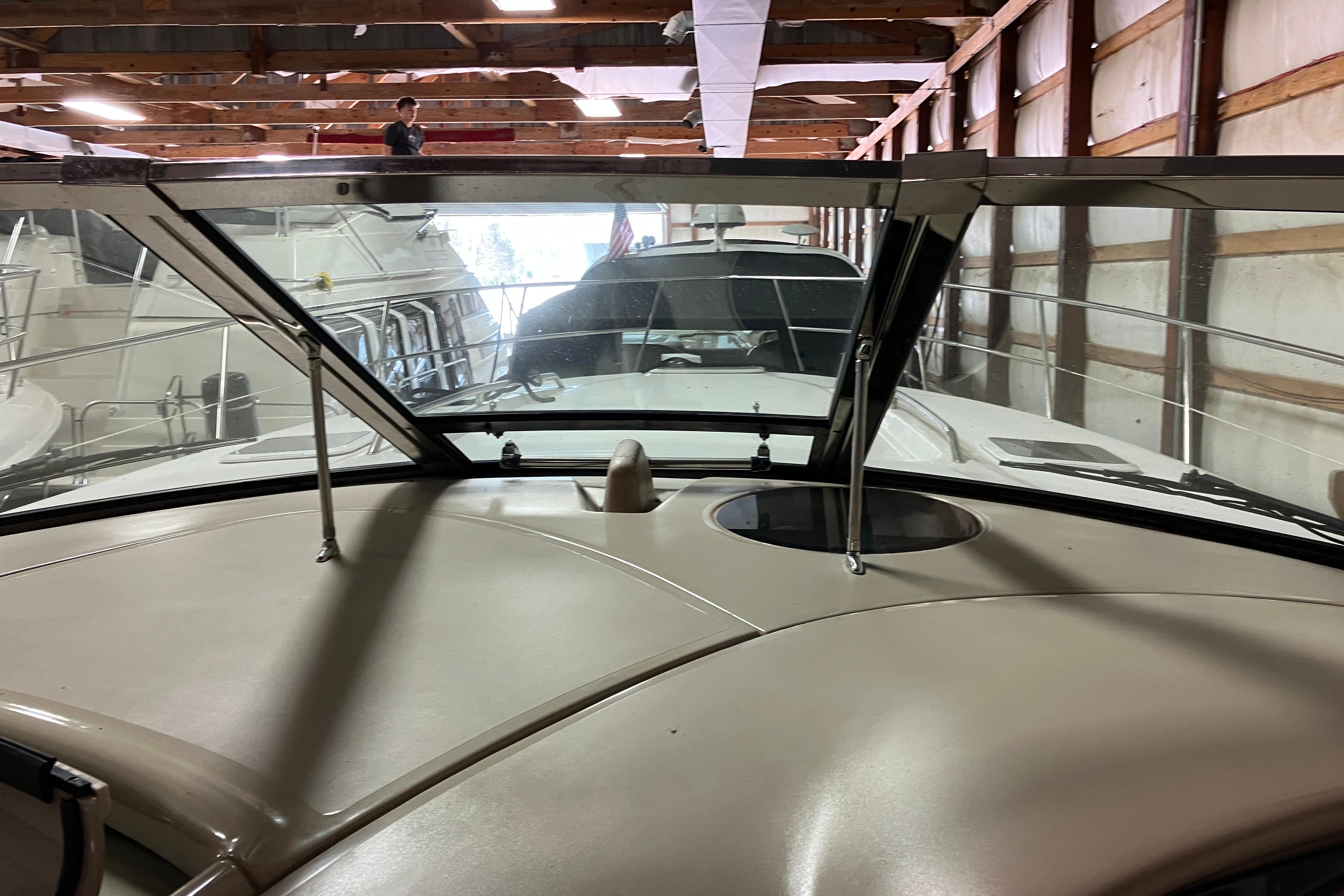 2002 Sea Ray 410 Sundancer yacht in storage, viewed from the helm.