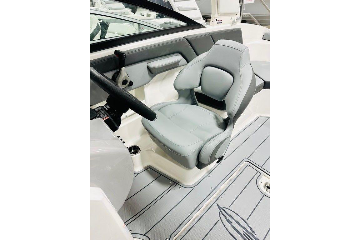 2025 Chaparral 23 SSi OB boat interior with sleek gray captain's seat and steering wheel.