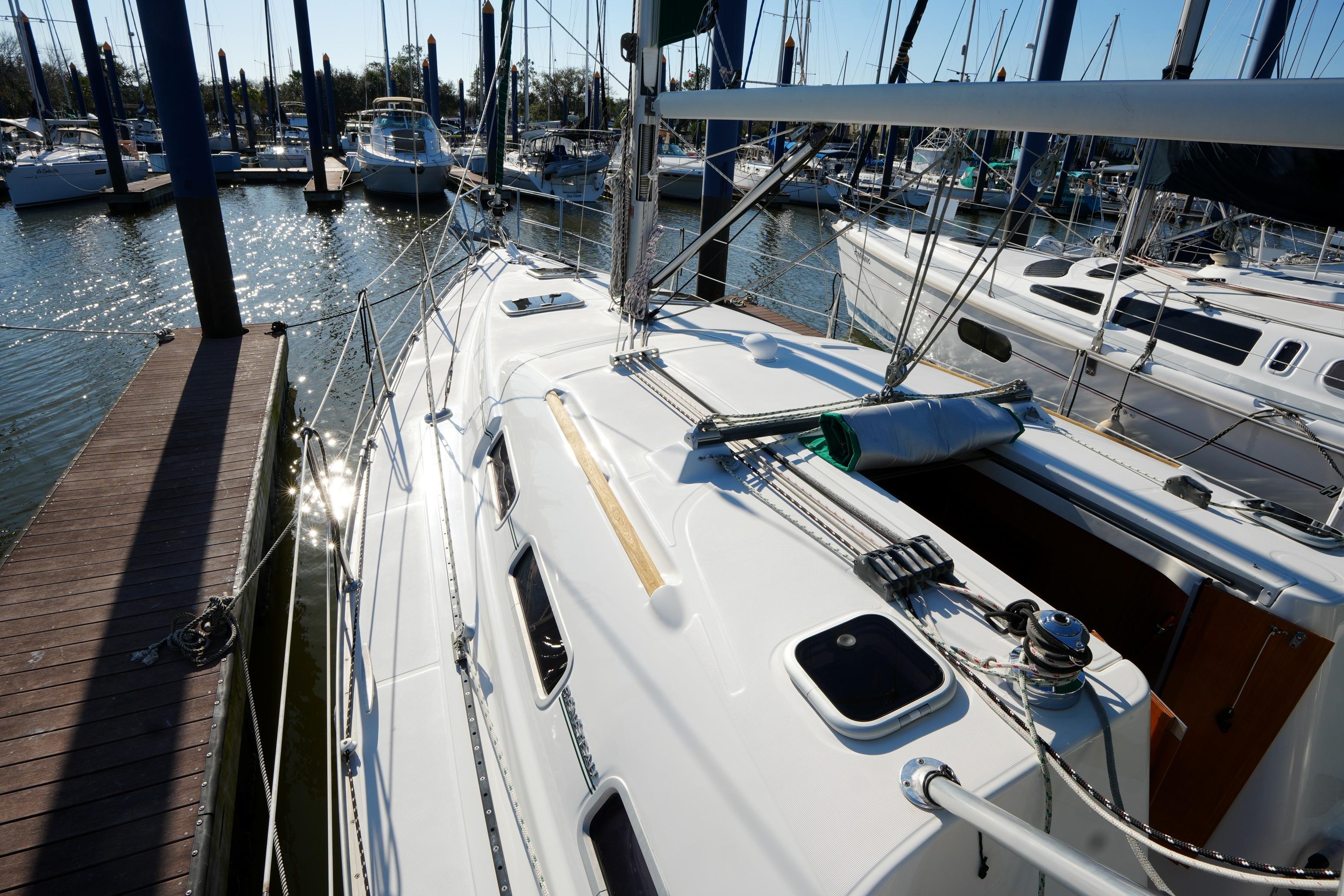 2007 Beneteau 373 sailboat docked at marina, showcasing sleek deck design.