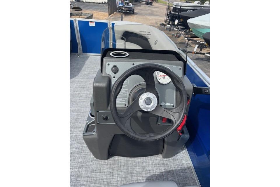 Steering console of 2026 Sun Tracker Party Barge 16 DLX pontoon boat.
