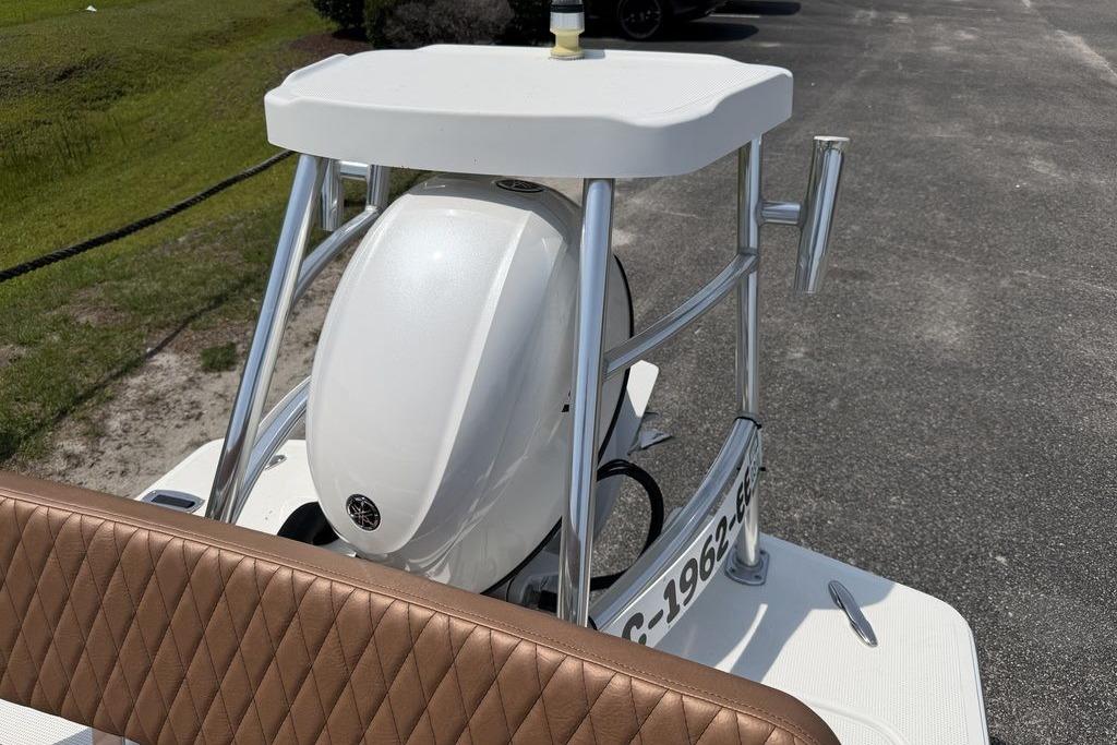 2012 Chaos 16 Bonefish boat with Yamaha engine, featuring a sleek design and brown seating.