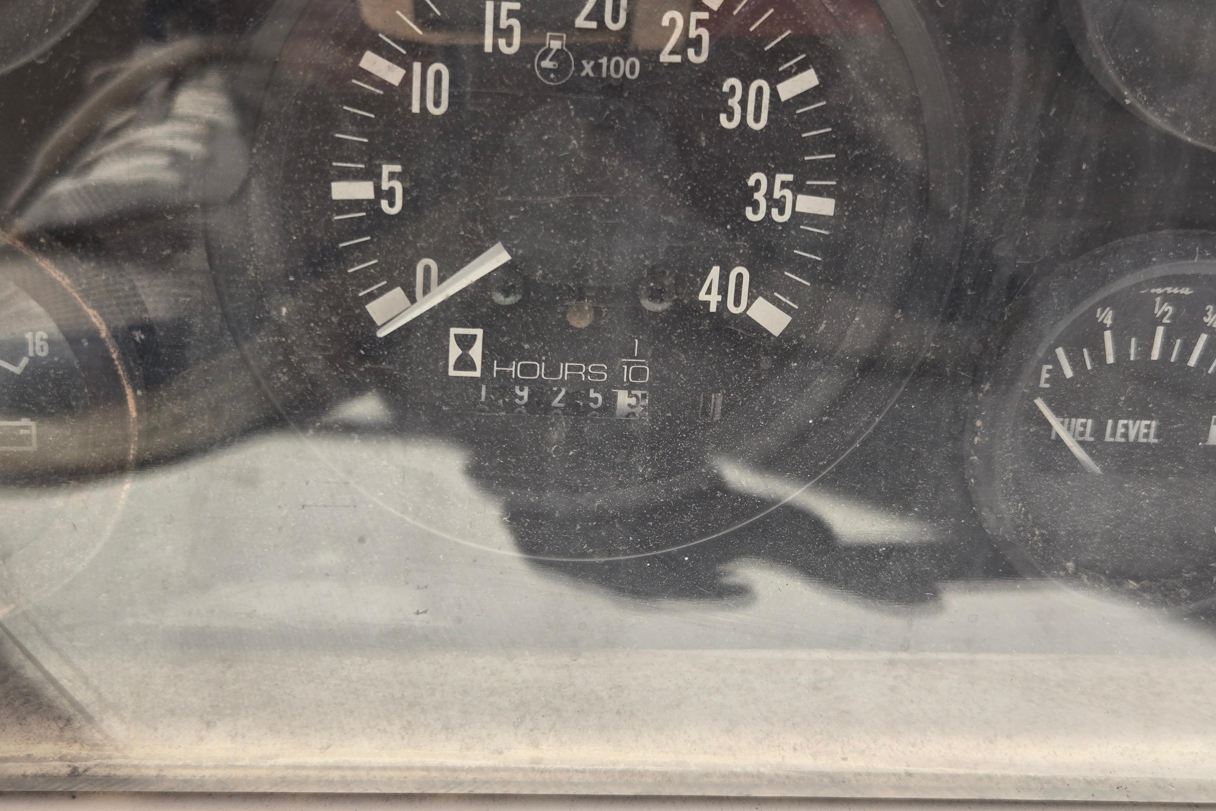 Close-up of a Sabre 38 boat's tachometer and fuel gauge, showing engine hours.