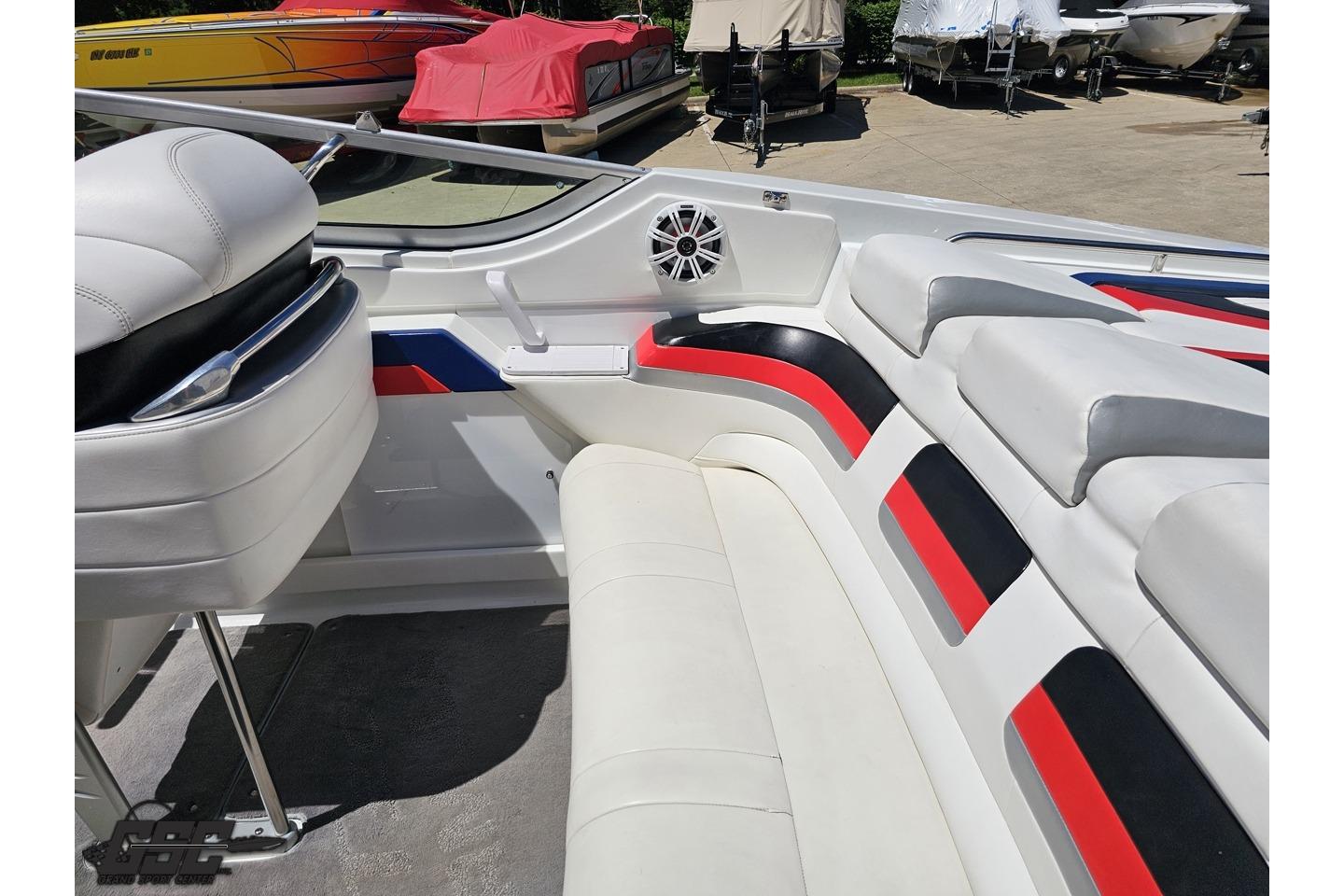 2005 Formula 271 FASTech boat interior with white, red, and black seating.